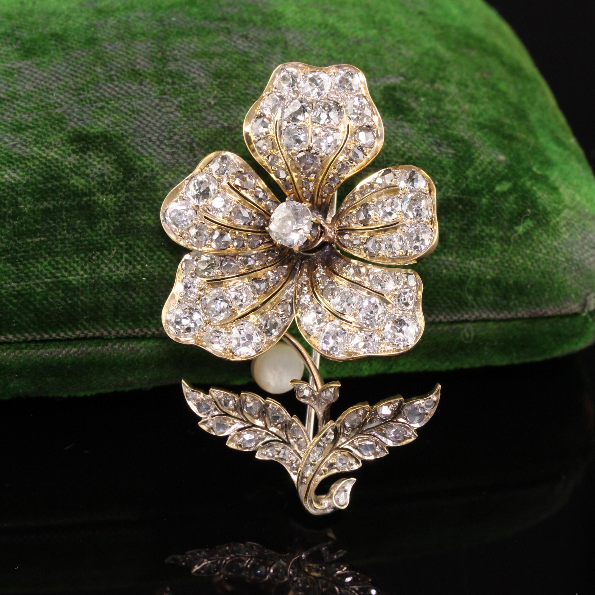Beautiful Antique Victorian 18K Yellow Gold Old Mine Diamond En Tremblant Flower Pin. This gorgeous flower pin is crafted in 18k yellow gold with a white gold clasp. The flower has old mine cut diamonds set all over the flower. Some of the petals