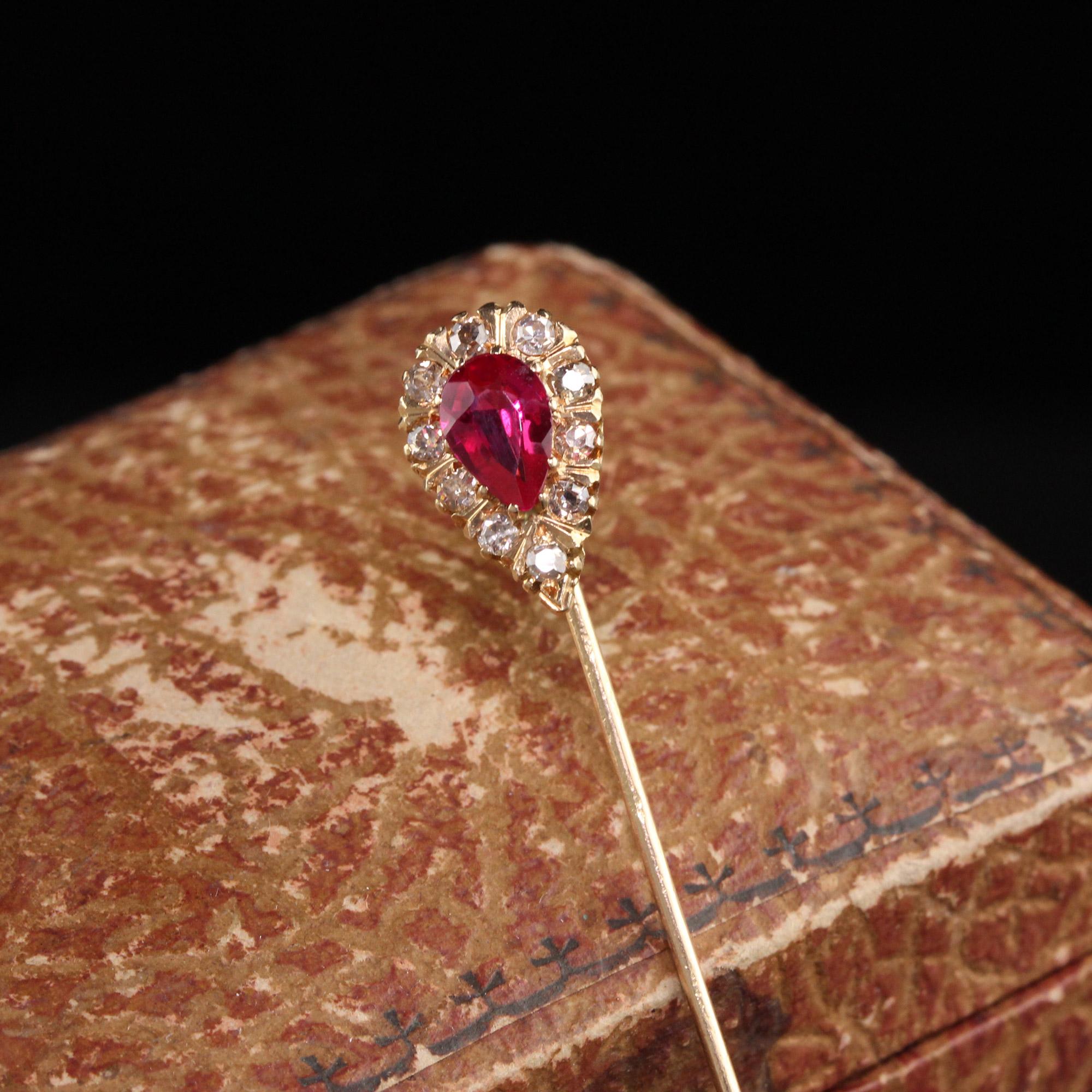 Beautiful Antique Victorian 18K Yellow Gold Old Mine Diamond Stickpin. This gorgeous stickpin has a synthetic ruby in the center and old mine cut diamonds surrounding it. It has a striking color and can even be converted to a pendant.

Item