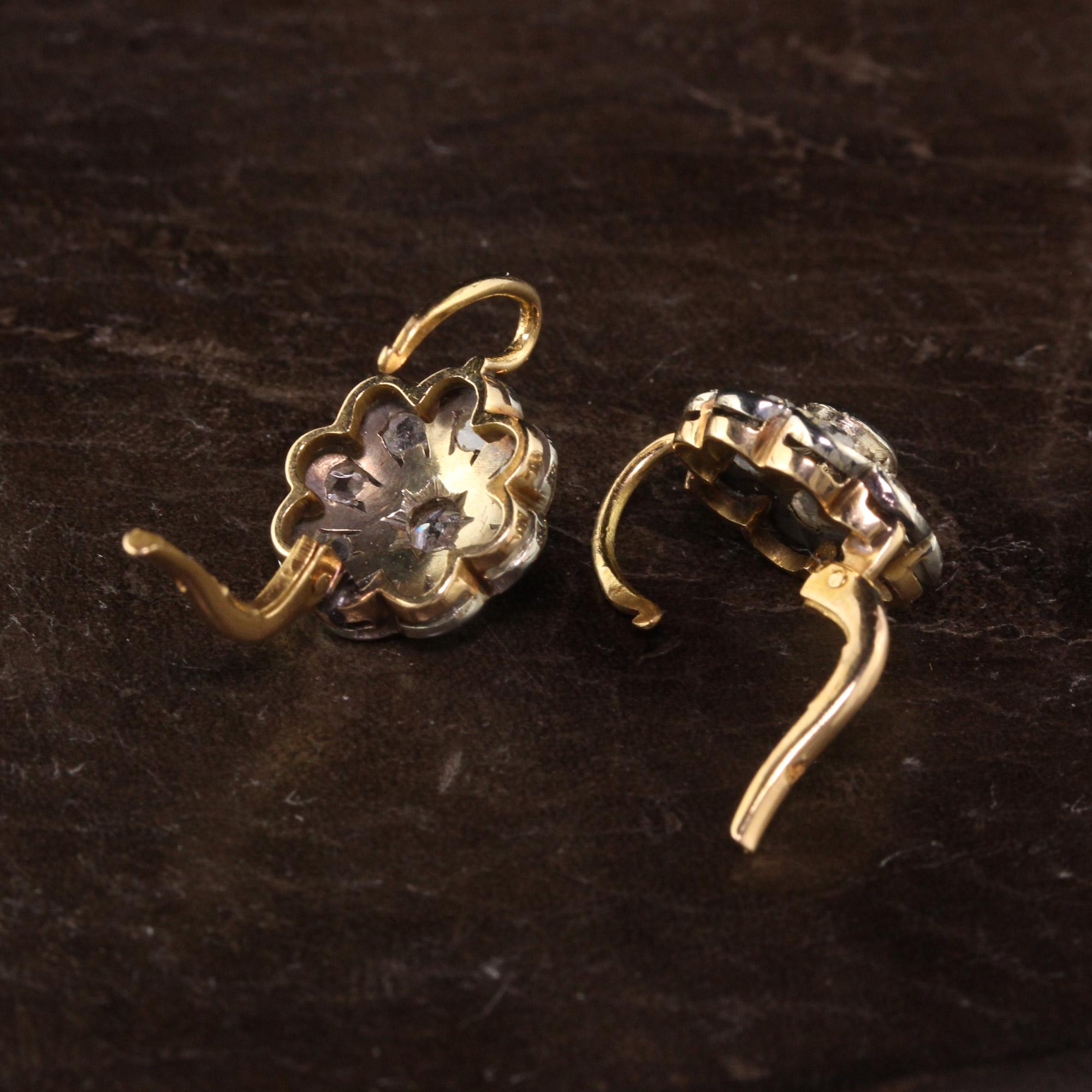 A gorgeous Antique Victorian 18K Yellow Gold Platinum Top Diamond Cluster Earrings. The center of the earrings have an old european cut diamond and they are surrounded by rose cut diamonds. The earrings are in great condition and sit well on the