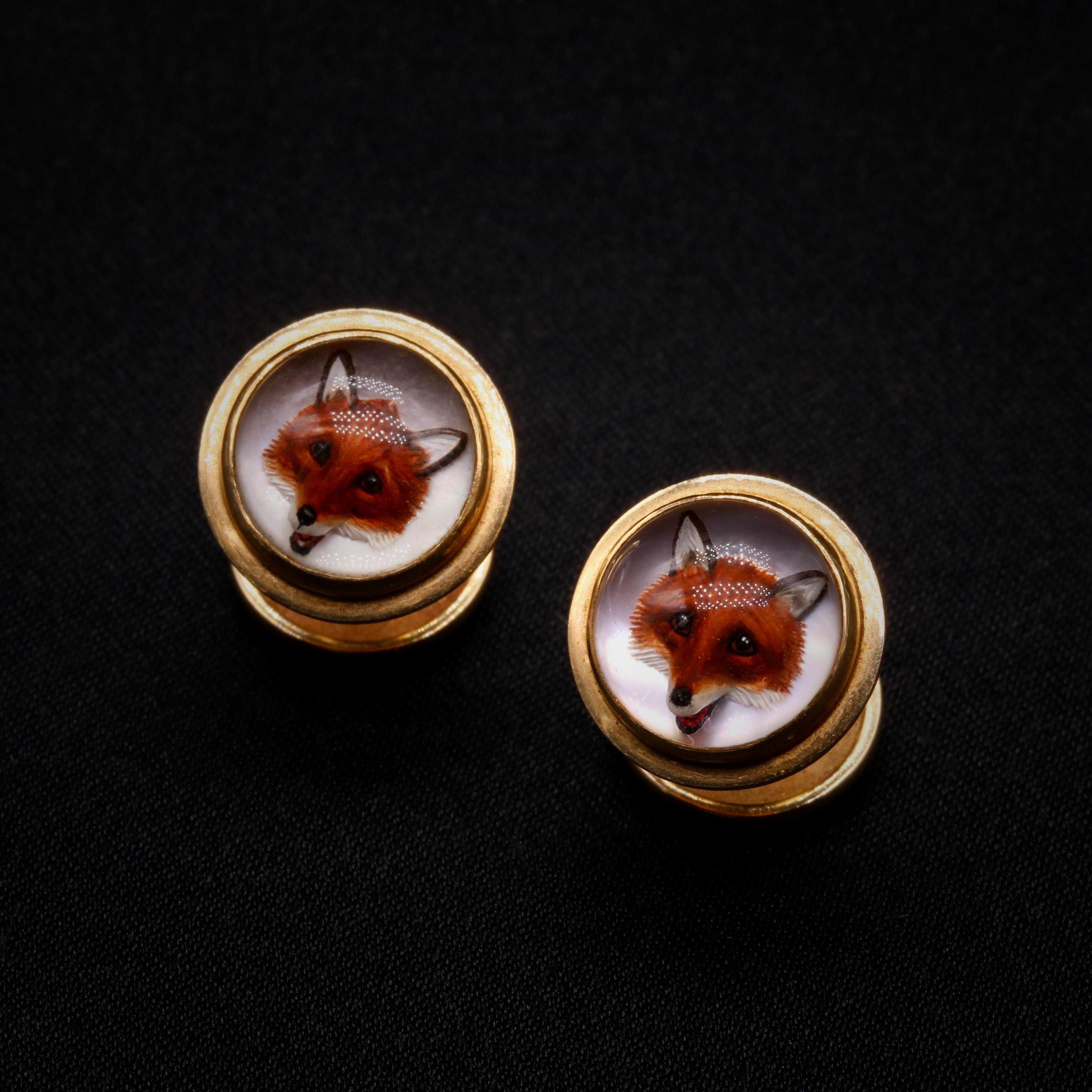 A pair of Victorian rock crystal and yellow gold cufflinks, each comprising a round cabochon rock crystal, painted with the image of a fox, set in 18 karat yellow gold, with 18 karat yellow gold fittings. 

These charming Victorian cufflinks each