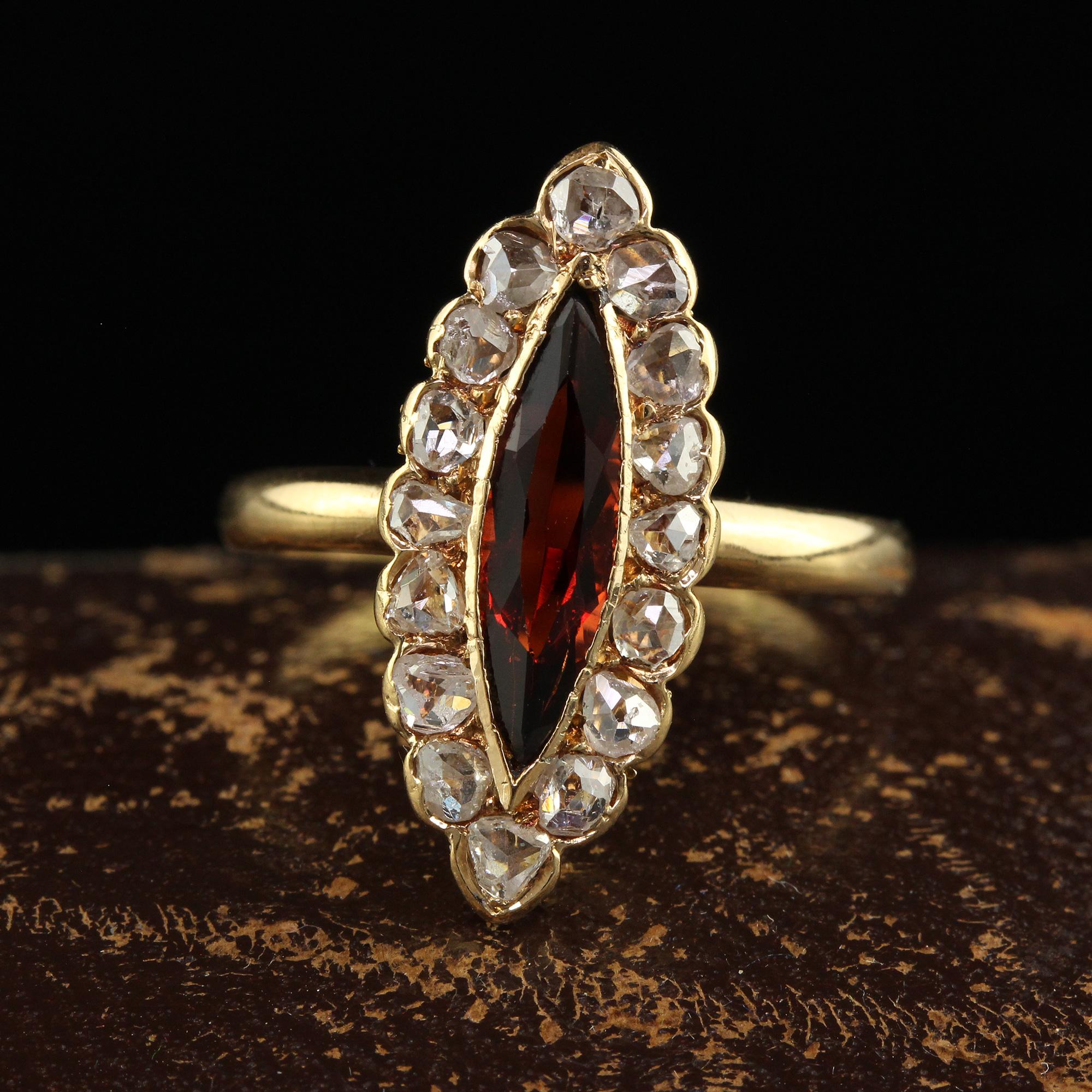 Beautiful Antique Victorian 18K Yellow Gold Rose Cut Diamond and Garnet Navette Ring. This gorgeous antique Victorian navette ring is crafted in 18k yellow gold. This ring features a marquise shaped garnet in the center with rose cut diamonds around