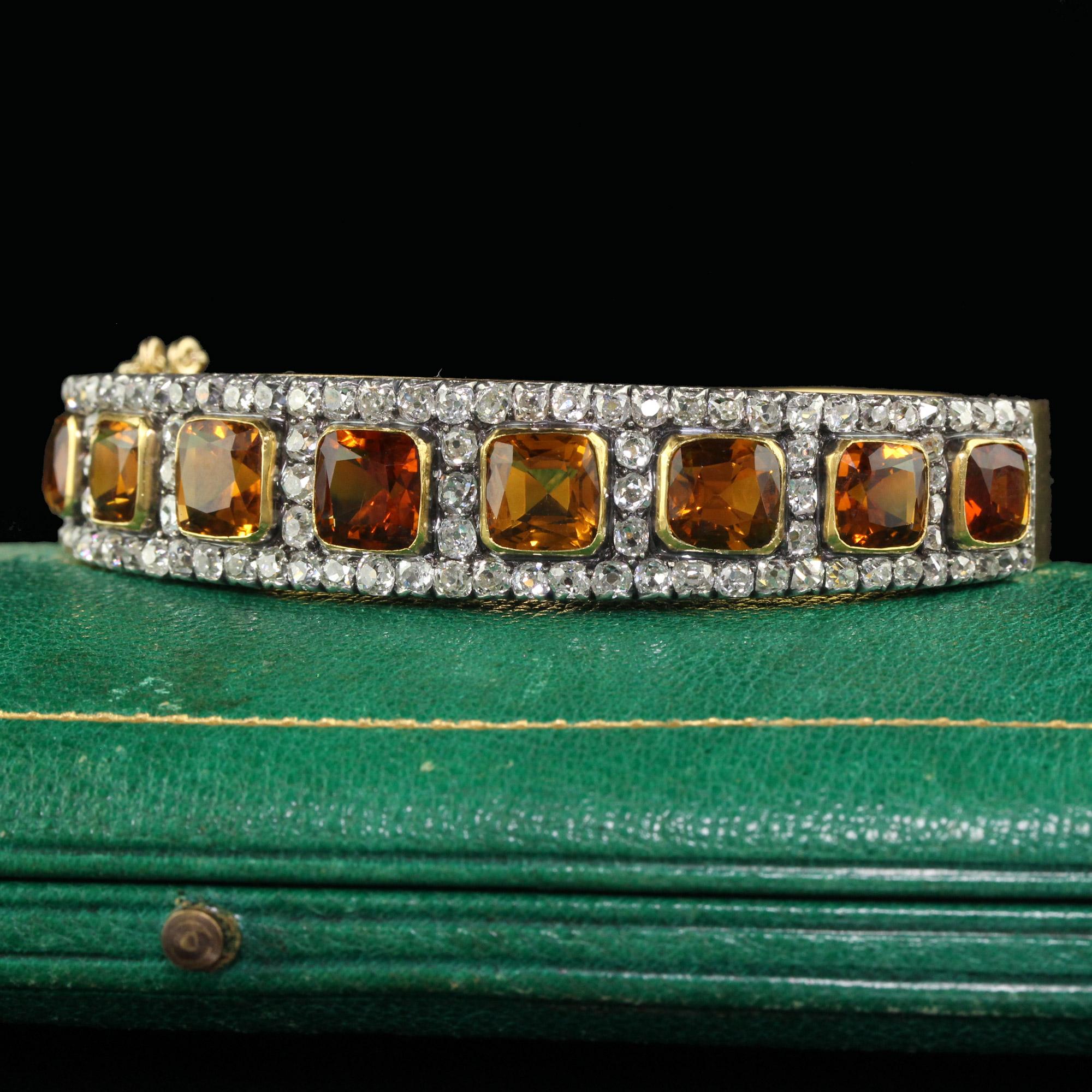 Beautiful Antique Victorian 18K Yellow Gold and Silver Old Mine Peruzzi Diamond and Citrine Bangle. This gorgeous bangle is crafted in 18k yellow gold and silver top. The top of the bangle has natural citrines and has rows of old mine cut diamonds