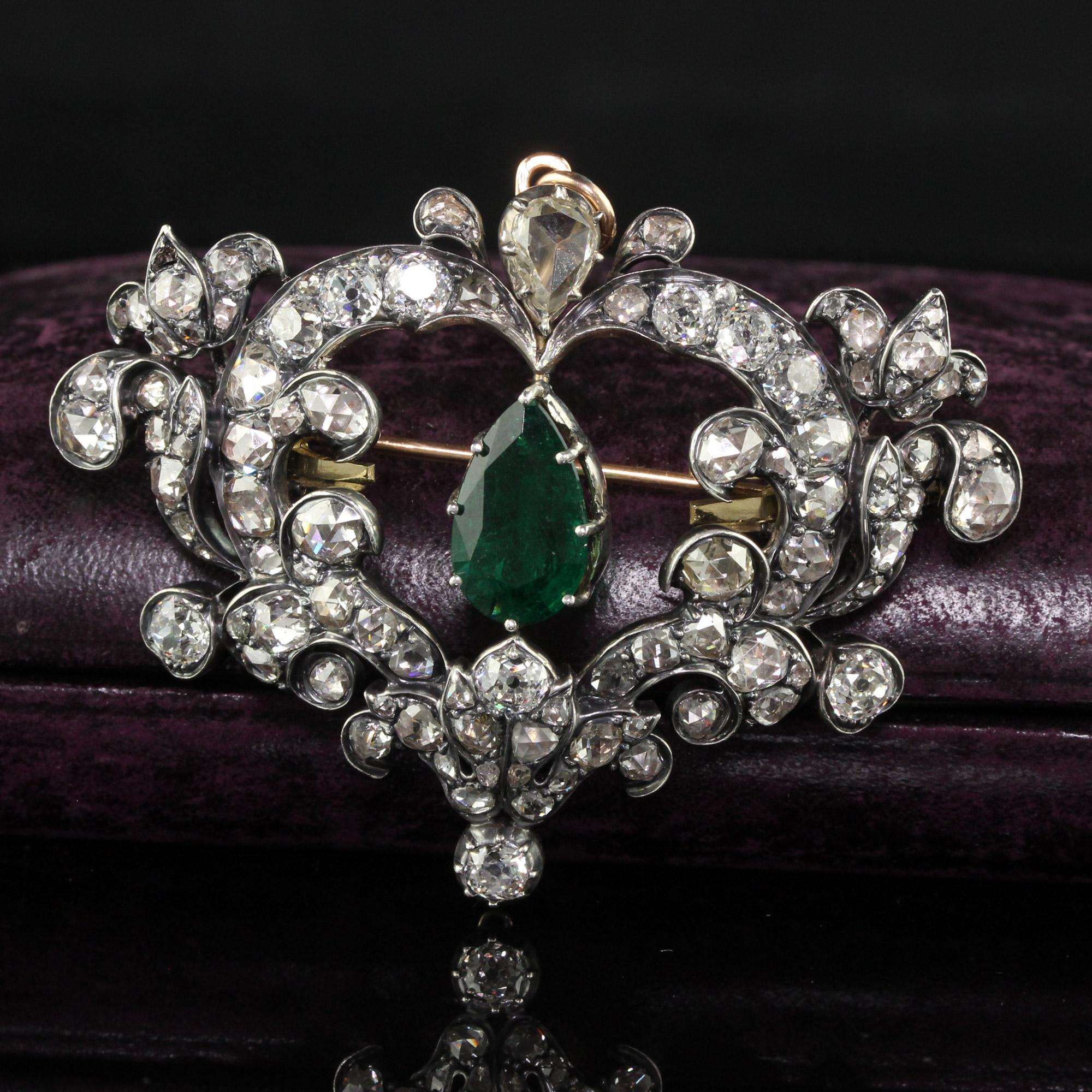 Beautiful Antique Victorian 18K Yellow Gold Silver Top Emerald and Diamond Pin Pendant. This stunning antique Victorian pin and pendant is crafted in 18k yellow gold and silver. The center holds a natural deep green pear shape emerald and has rose