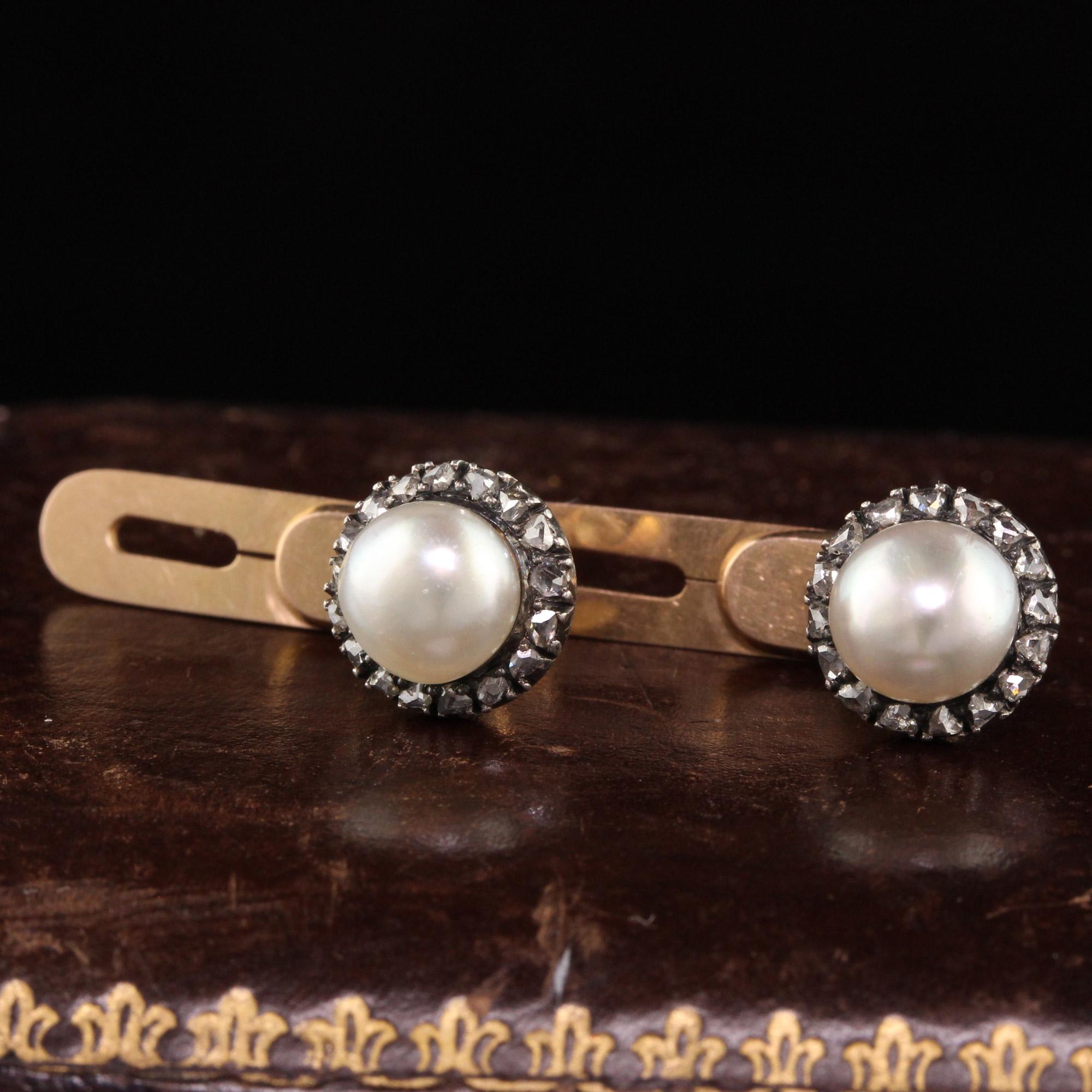 Beautiful Antique Victorian 18K Yellow Gold Silver Top Natural Pearl and Diamond Cufflinks. This gorgeous pair of cufflinks are crafted in 18k yellow gold and silver top. The cufflinks have two natural pearls in the center of each side with rose