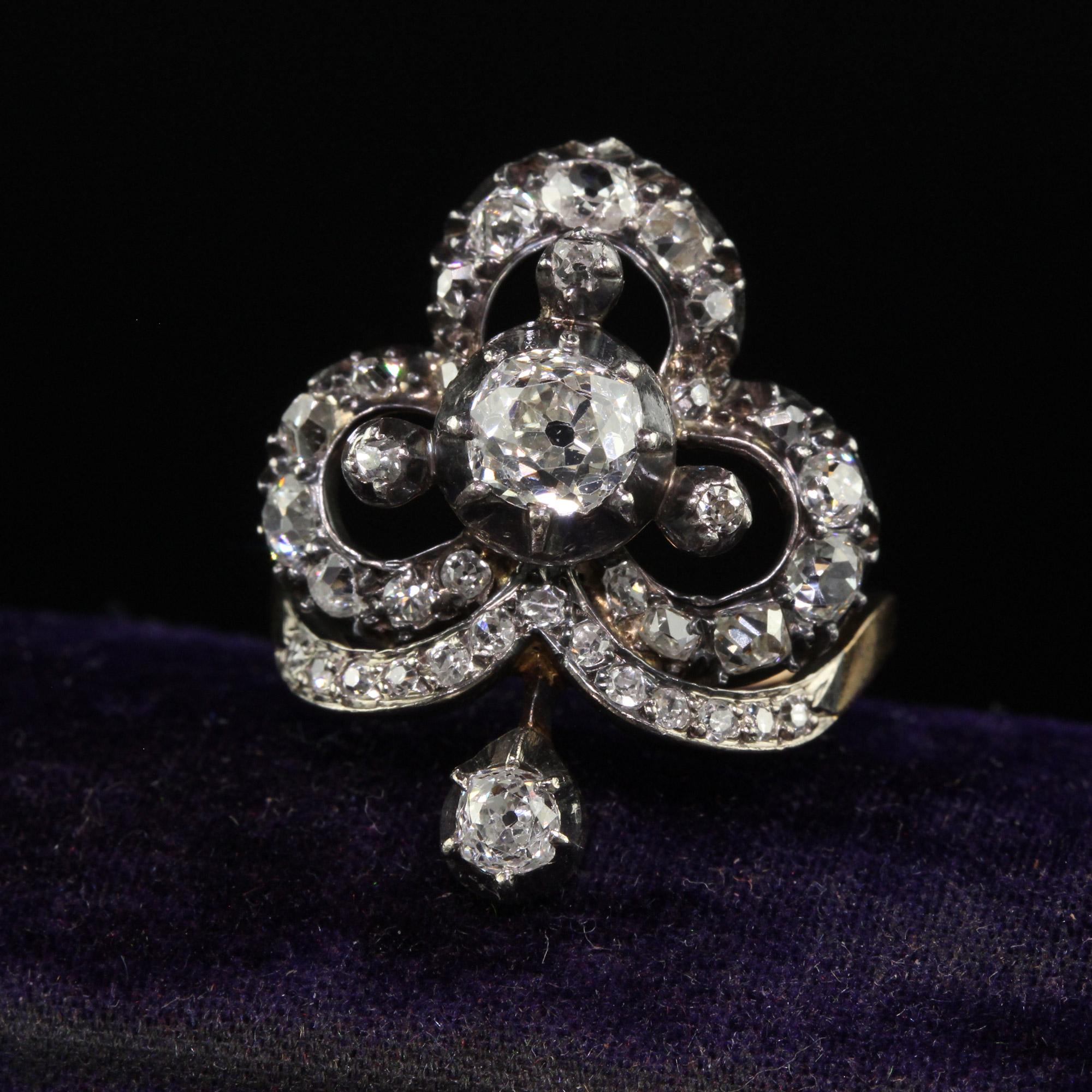 Beautiful Antique Victorian 18K Yellow Gold Silver Top Old Mine Diamond Clover Ring. This gorgeous early Victorian diamond clover ring is crafted in 18k yellow gold and silver top. The center of this ring holds a gorgeous chunky old mine cut
