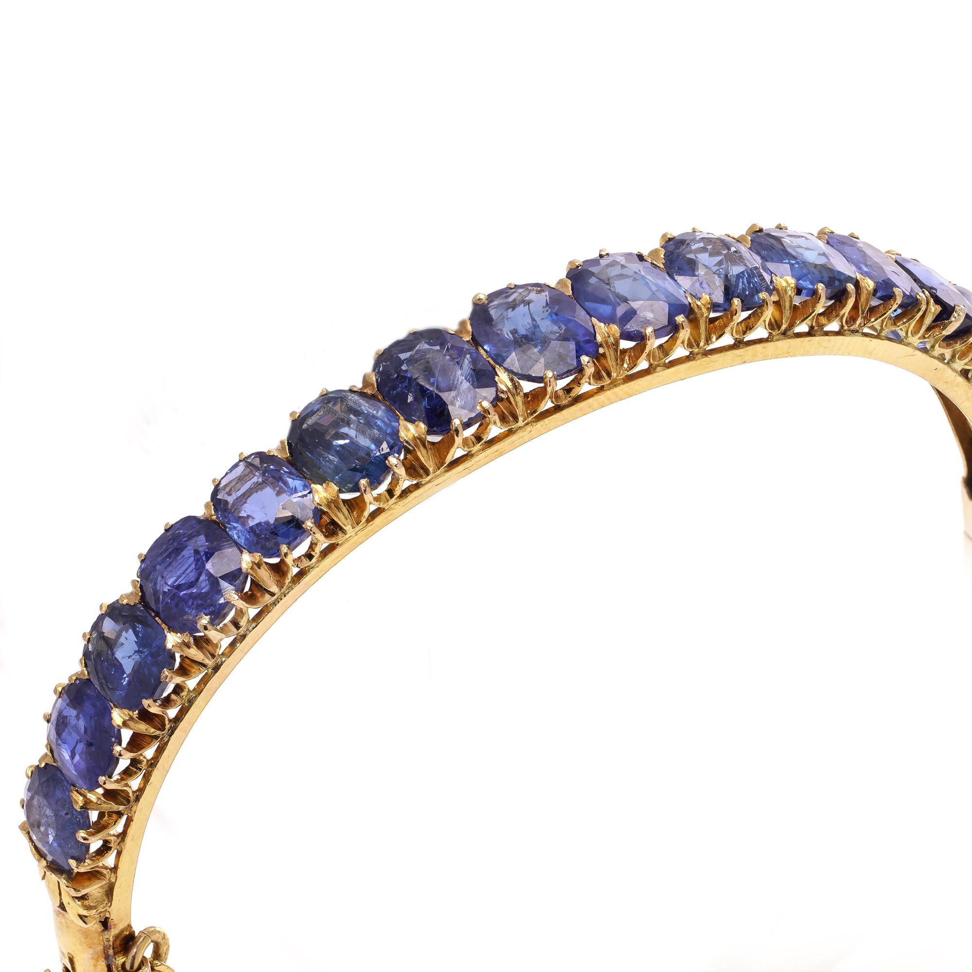Oval Cut Antique Victorian 18kt gold Sapphire bangle with safety chain. For Sale