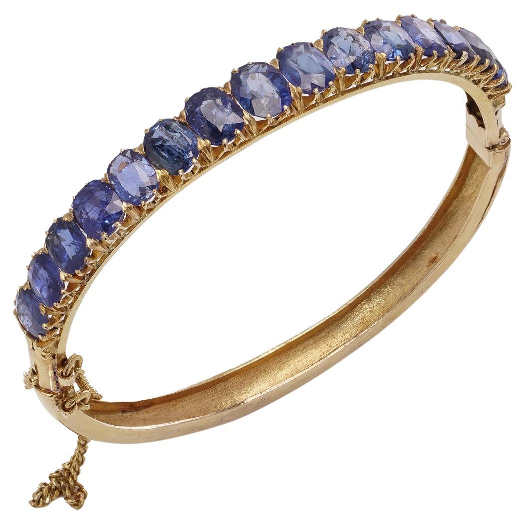 Antique Victorian 18kt gold Sapphire bangle with safety chain. For Sale