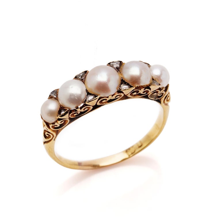 Antique Victorian 18kt yellow gold ladies ring with pearls and rose-cut diamonds.

Made in England, Circa 1860. 
Hallmarked for 18kt yellow gold. 

Dimensions - 
Ring Size: 2.4 x 2 x 0.5 cm 
Finger Size (UK) = Q (EU) = 57 1/2 (US) = 8 1/2 
Weight :