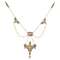 Antica collana vittoriana a festone in oro giallo 19k con perle di seme naturali