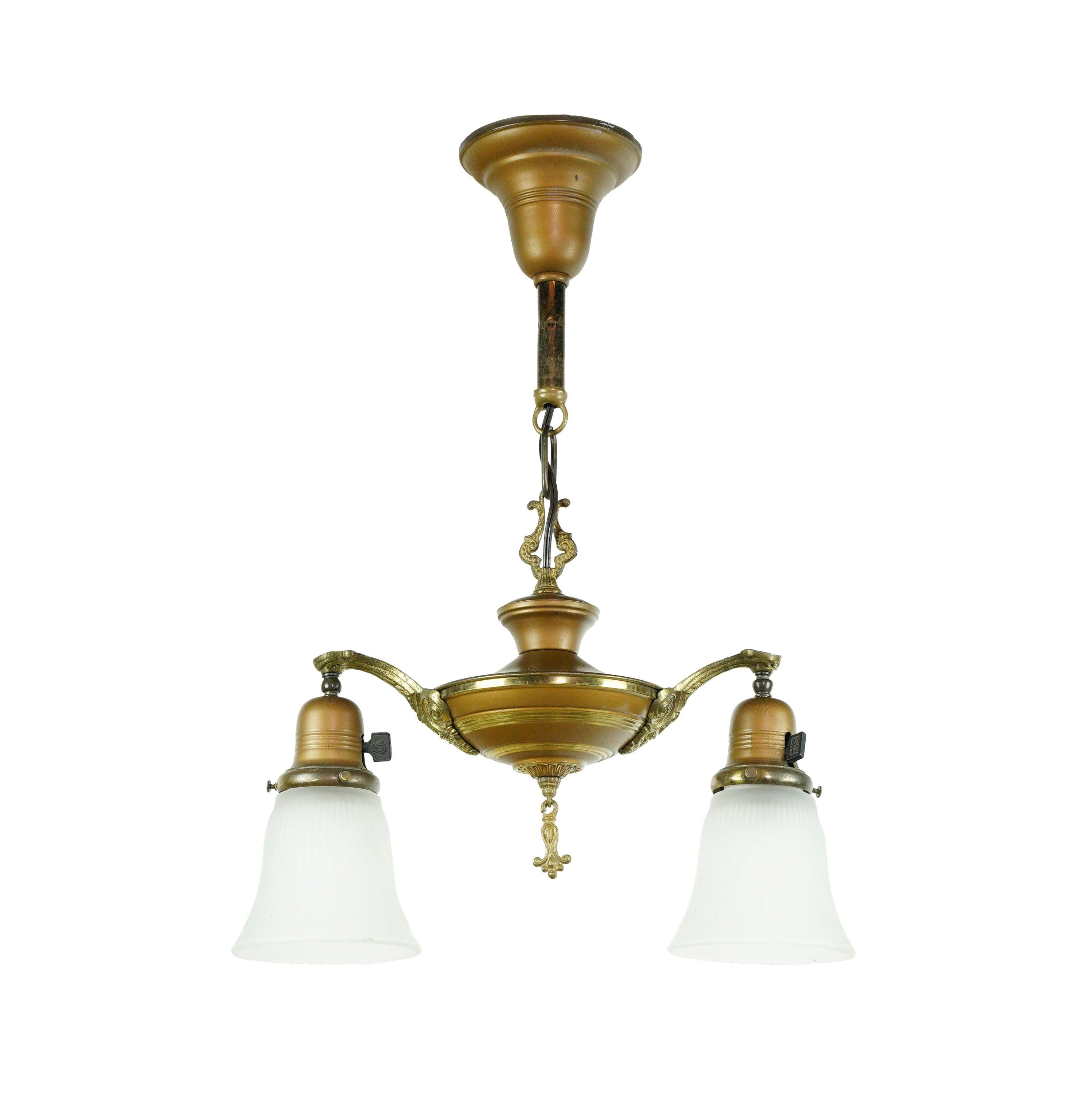 Victorian style brass down light pendant light with two opaque glass shades. This takes two standard medium base light bulbs. Cleaned and restored. This is in good condition, with age appropriate surface scratches. Please note, this item is located