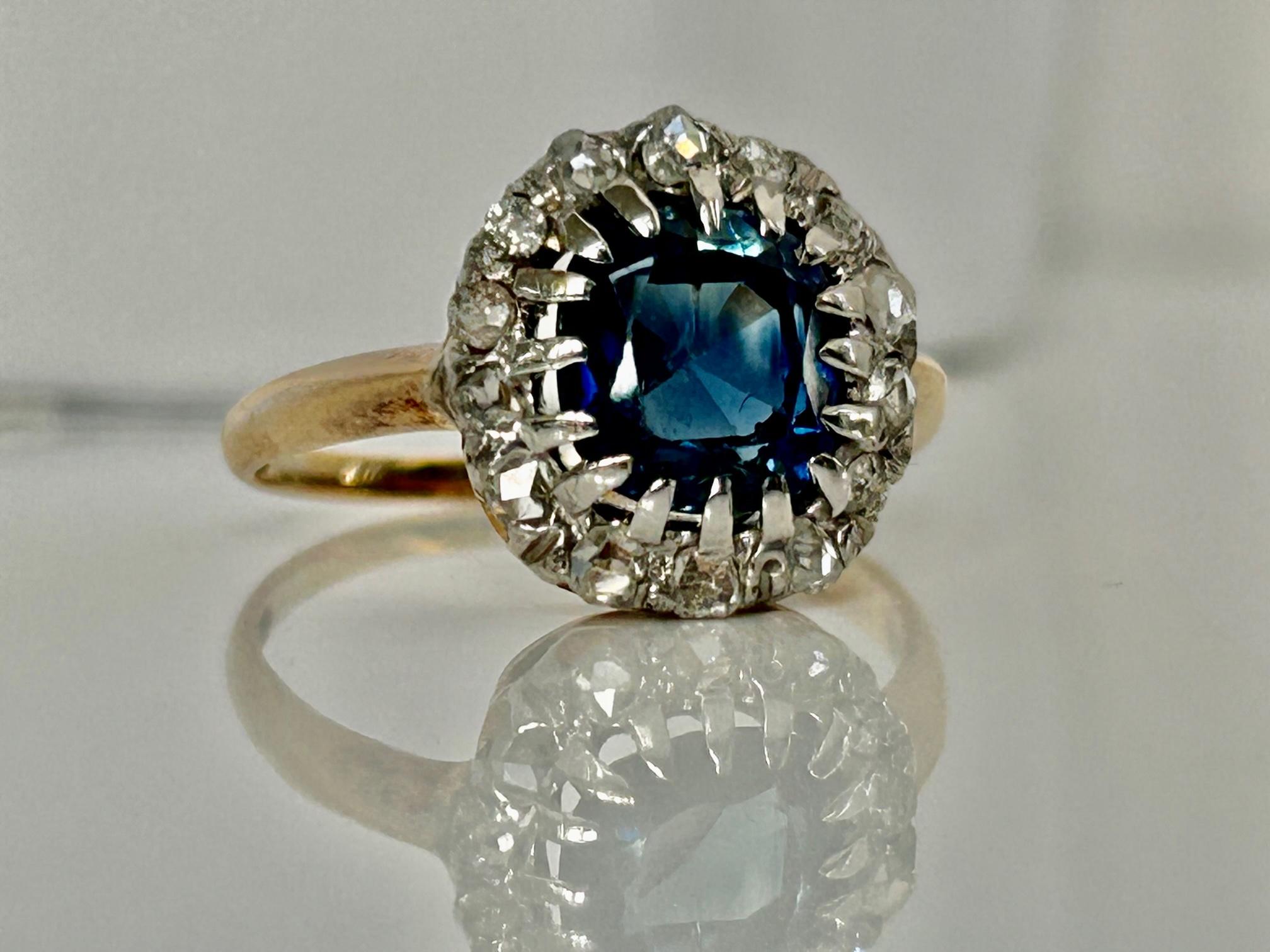 Late Victorian handmade 2.29 carat Cushion Cut Ceylon Sapphire and Rose Cut Diamond 18k gold and Platinum set Ring.
This cherished sapphire is very slightly Violetish blue Blue with excellent transparency.  
It's a color associated with elegance,