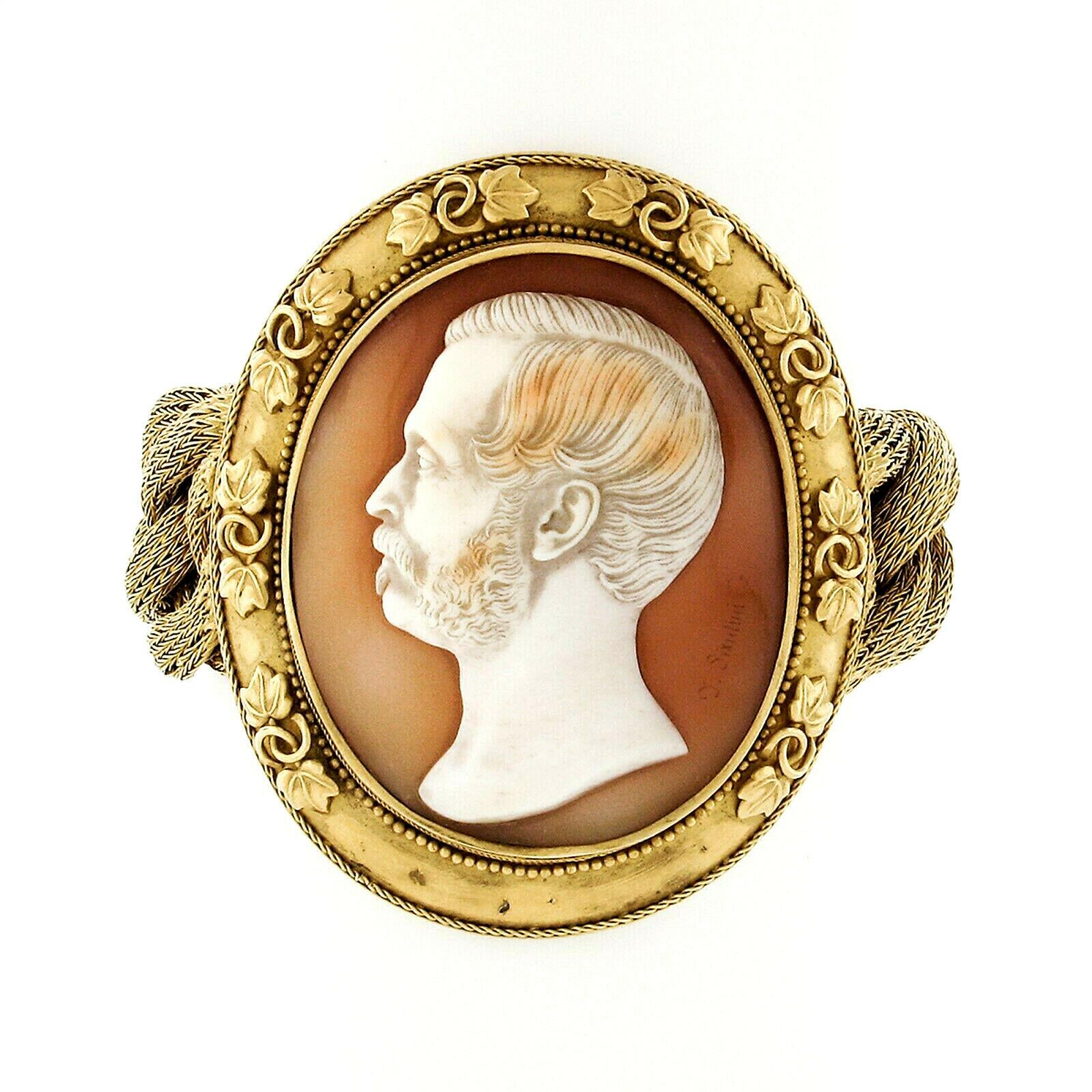 This incredibly designed antique statement piece is crafted in solid 21k gold during the Victorian era. The bracelet features a large center section that carries the amazing shell cameo that's signed by the artist Thomas Saulini. This shell stone is