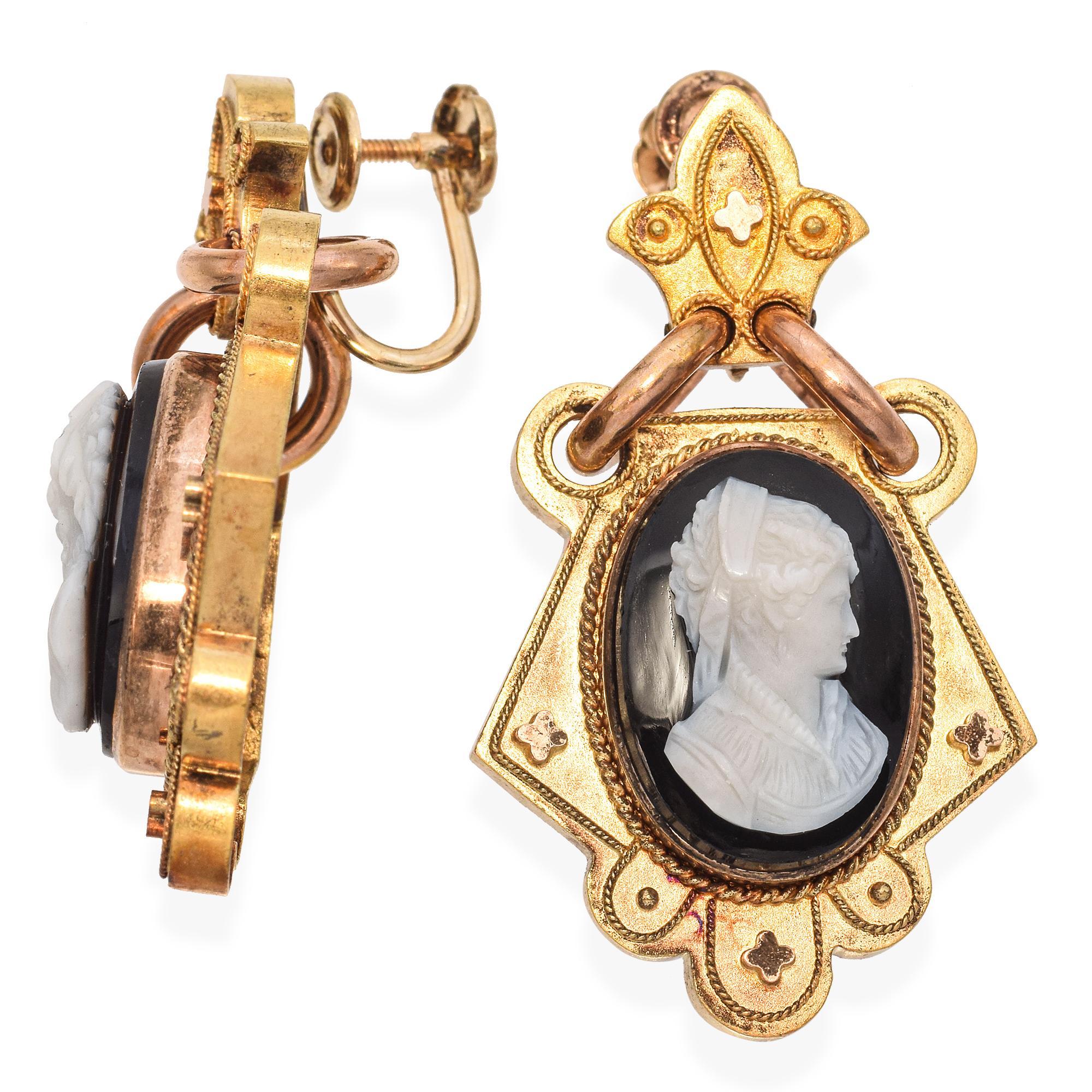 A striking pair of Victorian earrings featuring intricately carved hardstone cameos set against black onyx. The design showcases ornate detailing, reflecting mid 19th century craftsmanship.

Weight: 11.1 grams 
Stone: Onyx 
Measurements: 38 x 22 x
