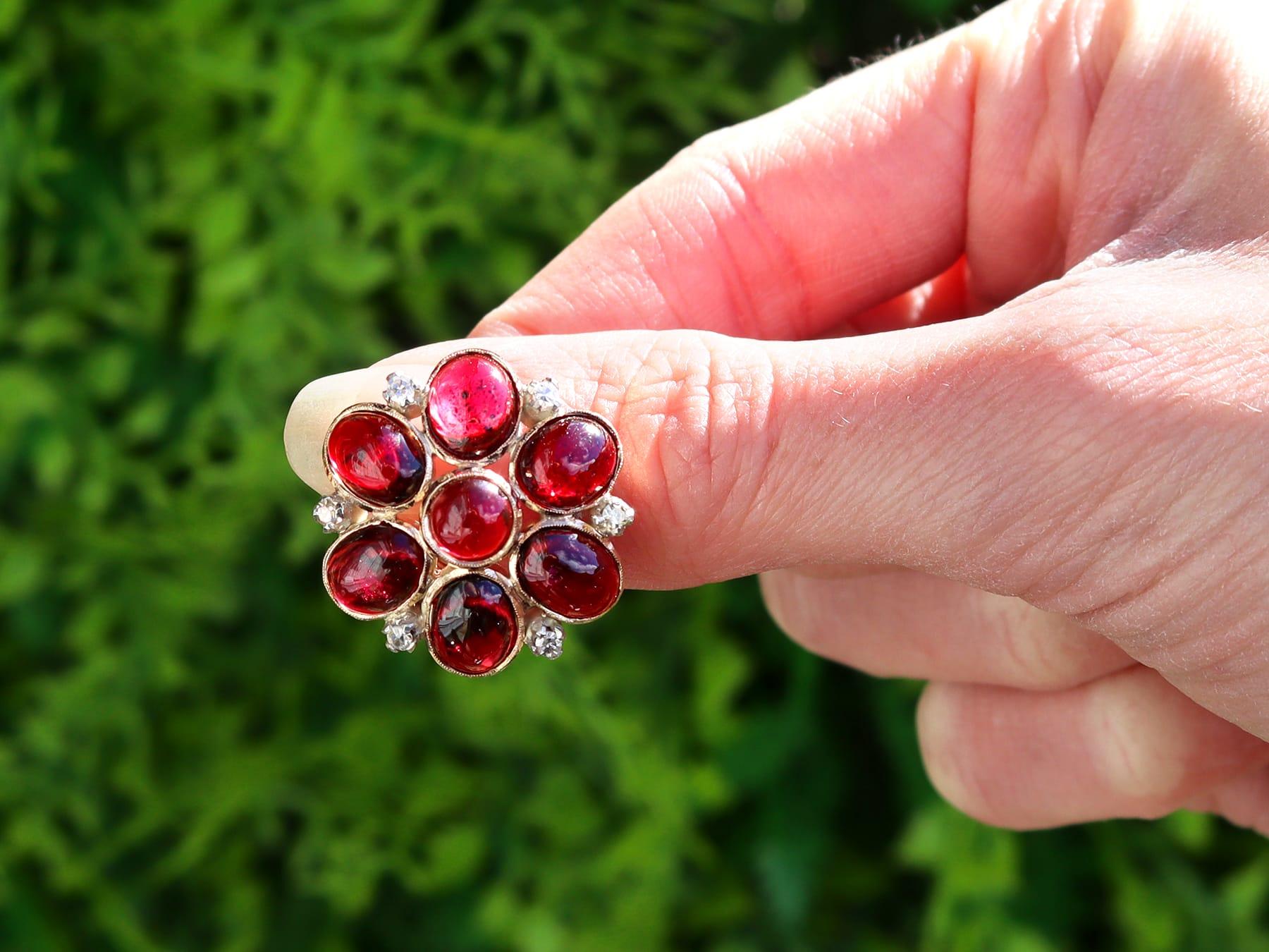 A fine and impressive pair of 22.28 carat garnet and 0.60 carat diamond, 9 karat rose gold and silver set clip on earrings; part of our diverse antique jewellery collections.

These fine and impressive antique Victorian antique clip-on earrings have
