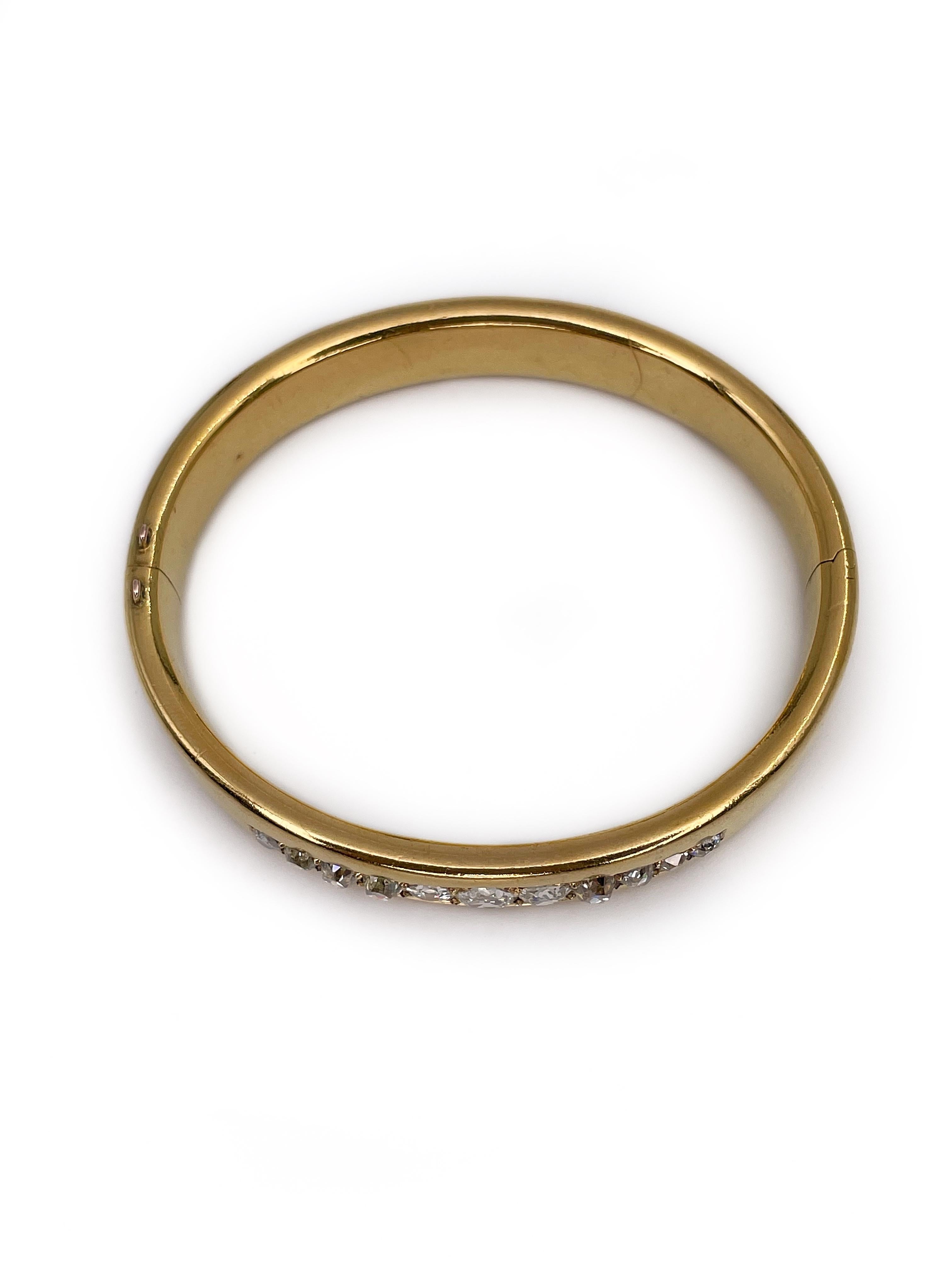 This is Victorian hinged bangle bracelet crafted in 22K yellow gold. The piece features 11 old mine cut diamonds. 

As antique, they are all of different parameters. Clarity is VS2-SI2. Colour ranges from G-H to J-K. 

These antique gems are amazing