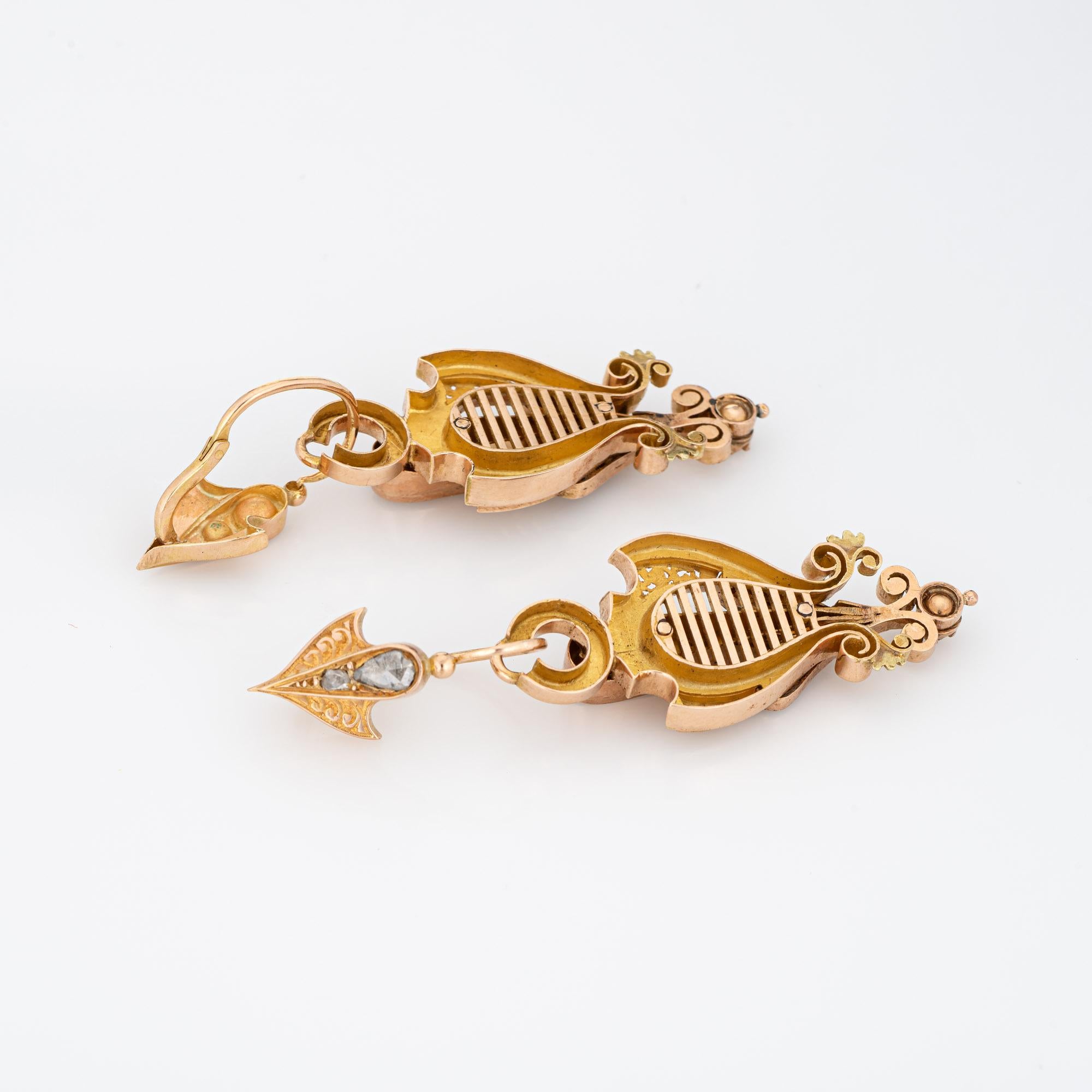 Elegant pair of antique Victorian earrings (circa 1860s to 1870s) crafted in 14k yellow gold. 

Old rose cut diamond range in size from 0.01 to 0.30 carats and total an estimated 2 carats (estimated at L-M color and I2-3 clarity).
The charming day &