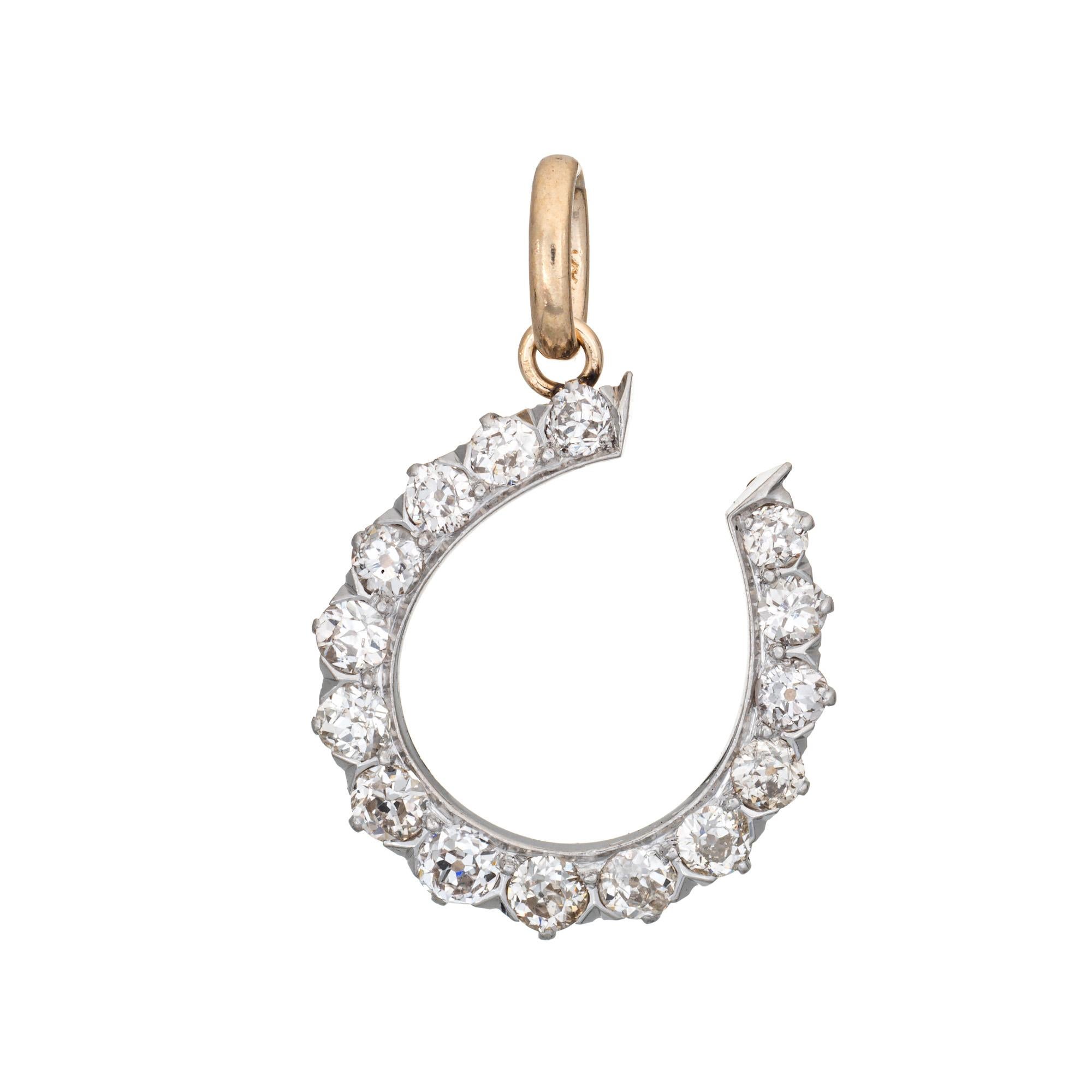 Finely detailed antique Victorian horseshoe pendant crafted in 14 karat yellow gold and platinum (circa 1880s to 1900s). 

15 old mine cut diamonds graduate in size and total an approx. 2 carats (estimated at K- color and VS2-I1 clarity).  

The