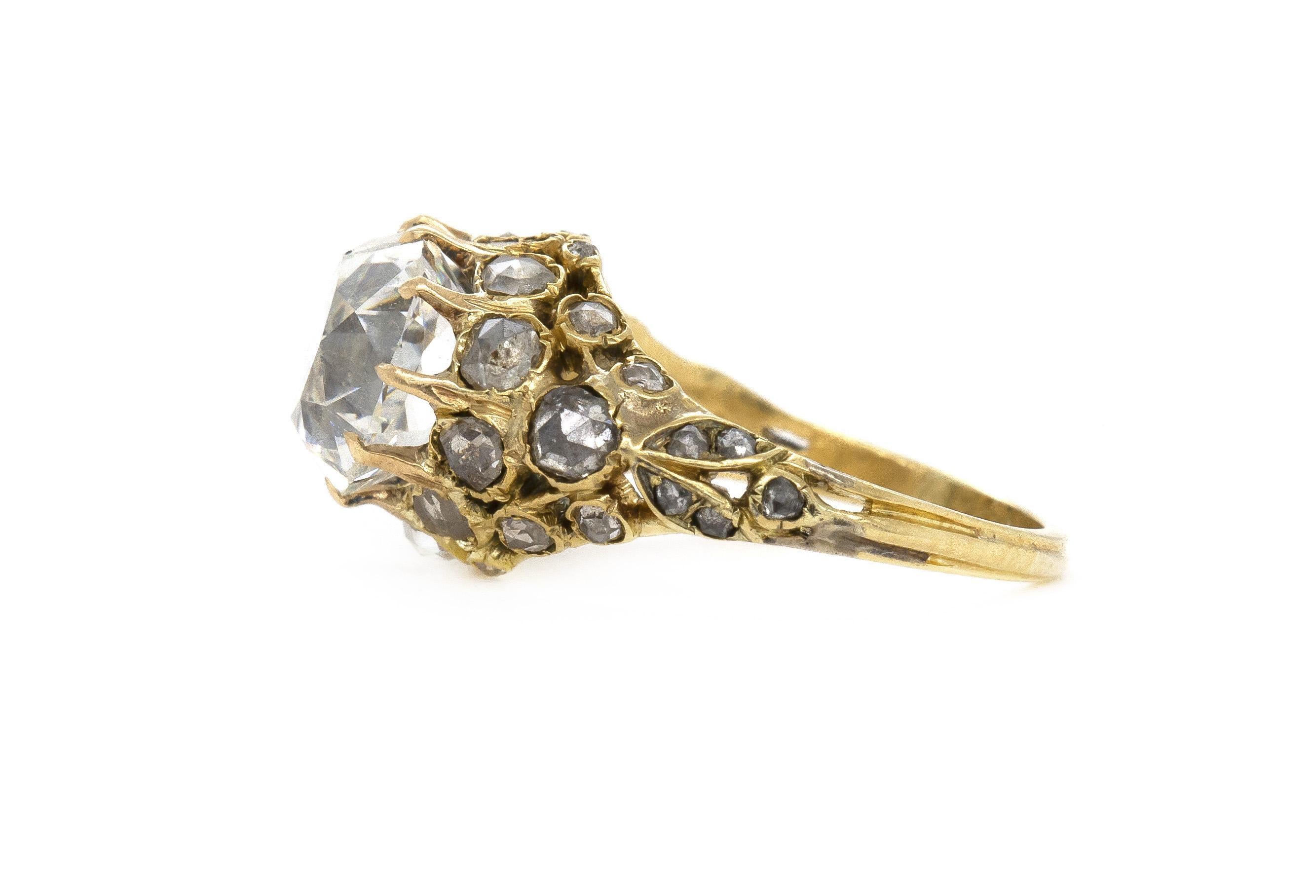 Finely crafted in 18k yellow gold with a GIA certified Old Mine cut Diamond weighing 3.20 carats, H color, VS2 clarity, GIA #11877075.
The ring features accenting Rose cut Diamonds on the setting weighing a total of approximately 0.75 carats.
Circa