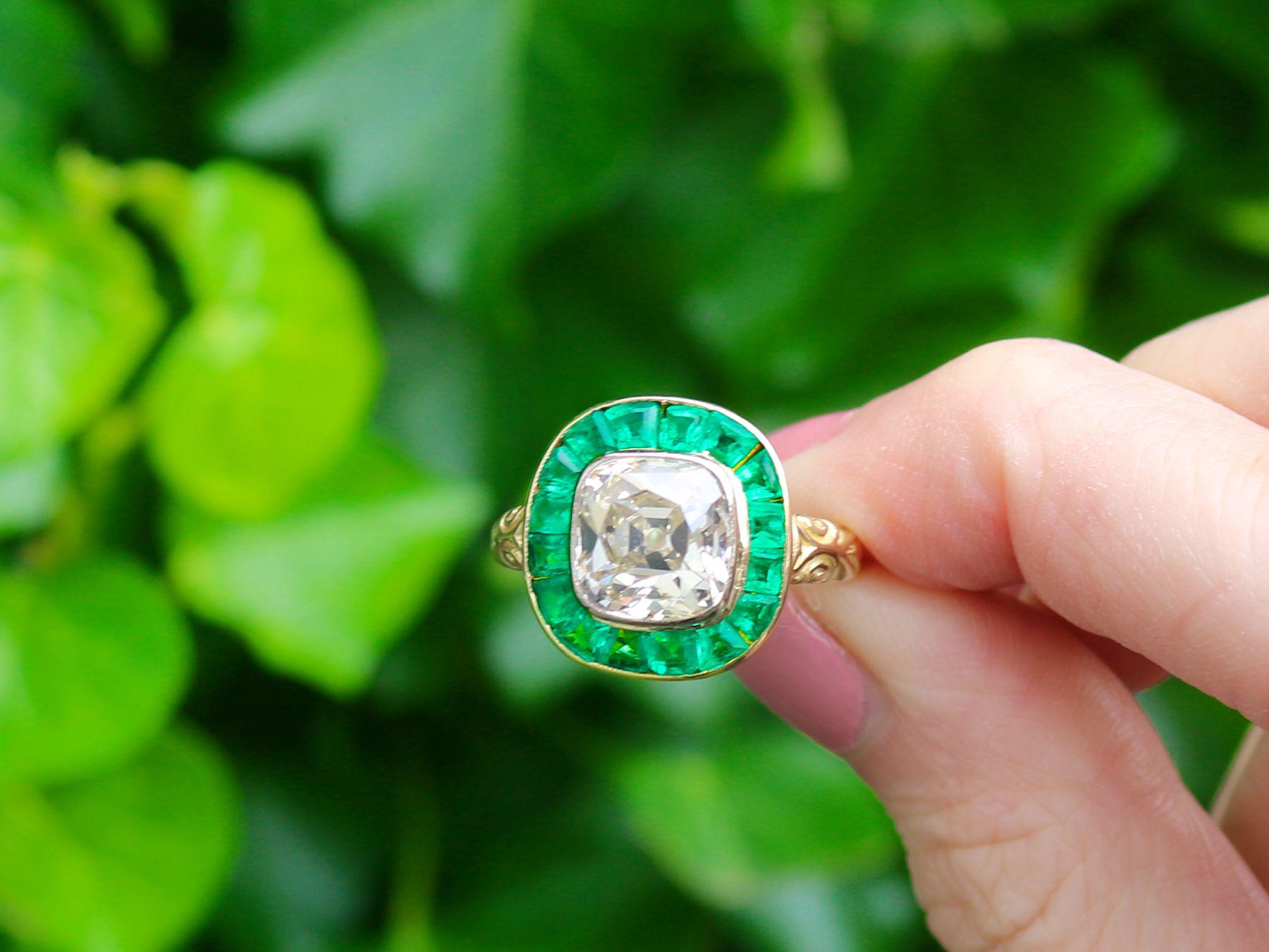 A stunning antique Victorian 3.25 carat emerald and 1.92 carat diamond, 18 karat yellow and white gold cocktail ring; part of our diverse antique jewelry and estate jewelry collections.

This stunning, fine and impressive Victorian emerald ring has