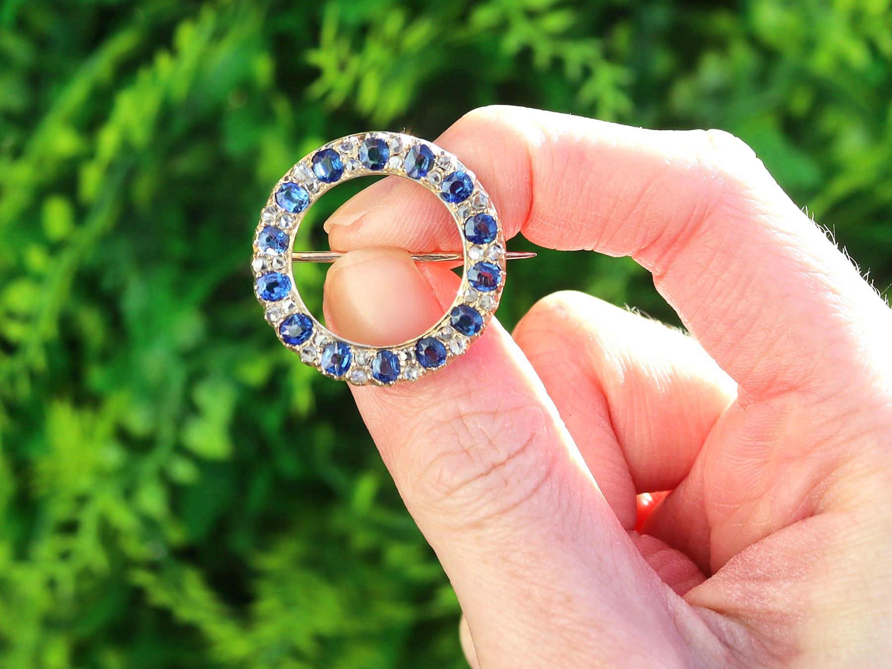 A stunning, fine and impressive antique Victorian 0.60 carat diamond and 3.36 carat sapphire, 15 karat yellow gold circular brooch; part of our diverse Victorian jewellery collections

This stunning, fine and impressive antique sapphire brooch has