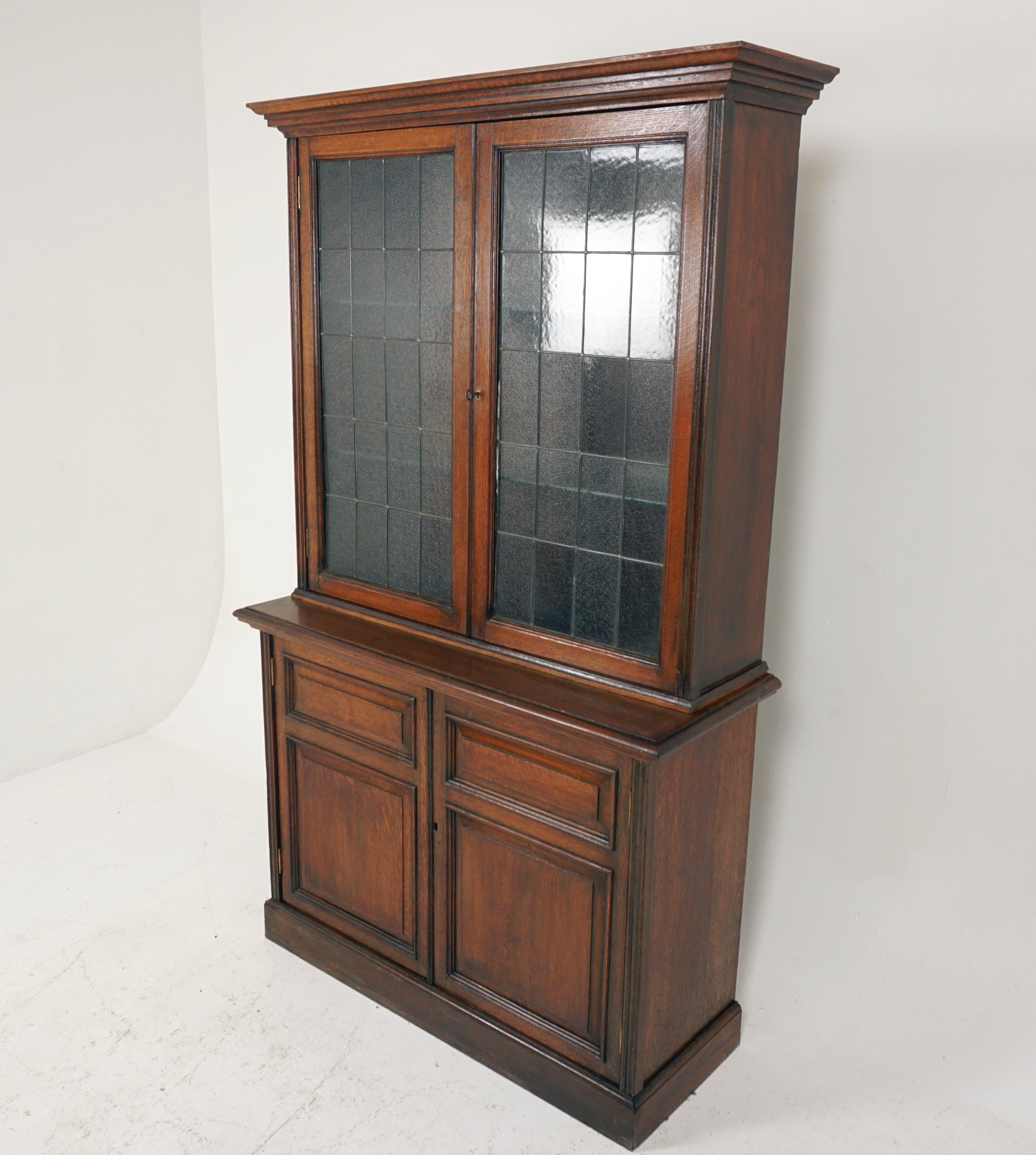 Antique Victorian 4 door bookcase, display cabinet, Scotland 1900, H277

Scotland 1900
Solid oak
Original finish
Moulded cornice on top
Pair of original textured glass doors with moulding to the front
Doors open to reveal shelves
Base has a pair of