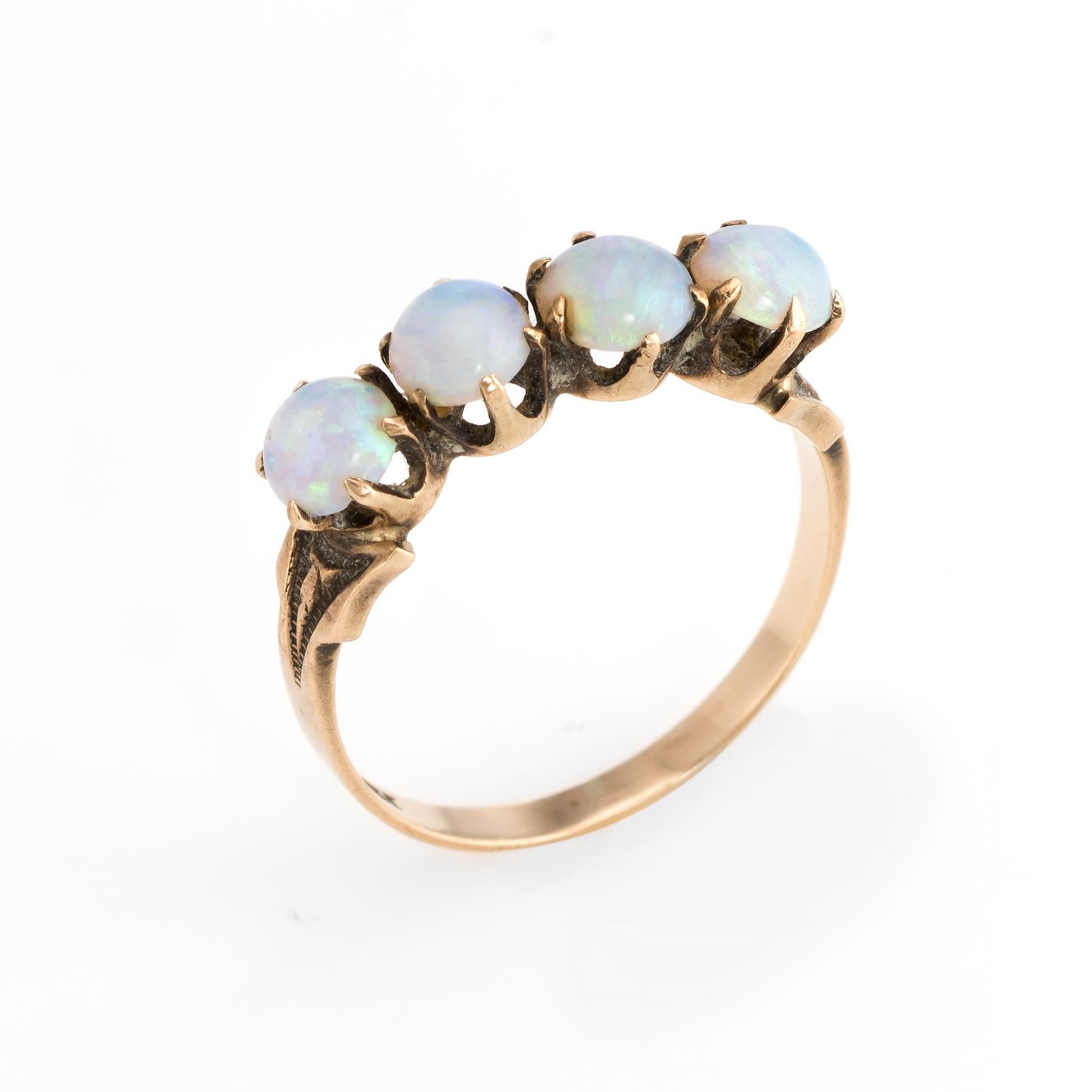 Finely detailed antique Victorian 4 stone opal ring (circa 1880s to 1900s), crafted in 10 karat rose gold. 

Natural opals each measure 4.5mm (estimated at 0.40 carats each - 1.60 carats total estimated weight). Note: slight chip to one opal