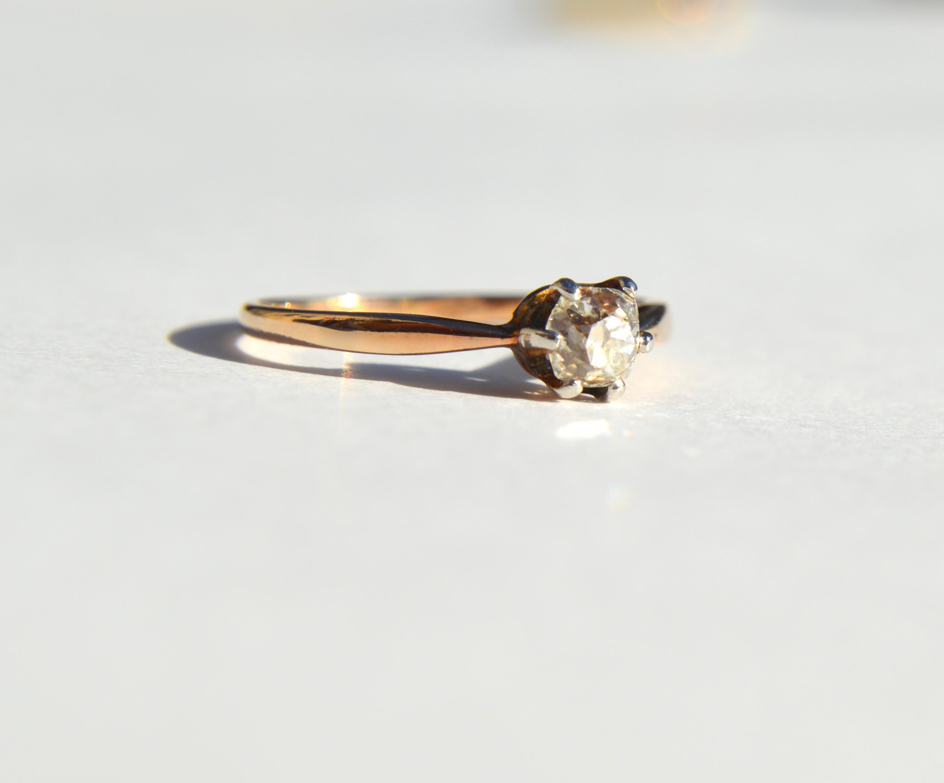 Beautiful antique Victorian era circa late 1800s .46 carat old minecut diamond solitaire engagement ring in 14K rose gold. Size 5, can be resized by your local jeweler. Diamond has been graded as color L, VS1 clarity (very slightly included). In