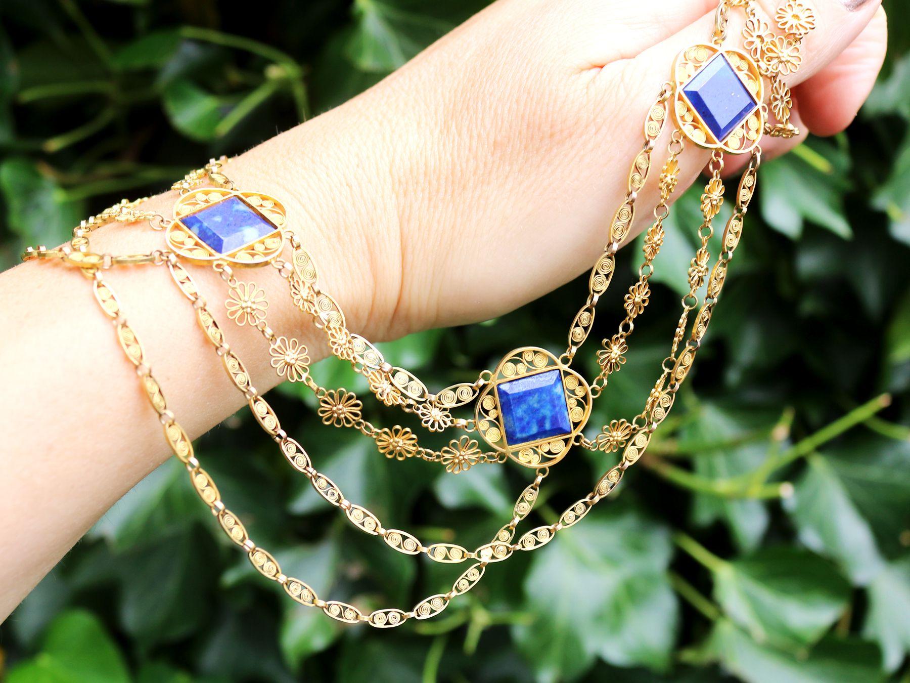 A stunning, fine and impressive antique Victorian 5.55 Carat lapis lazuli and 18 karat yellow gold necklace; part of our diverse antique jewelry and estate jewelry collections.

This stunning, fine and impressive Victorian necklace has been crafted