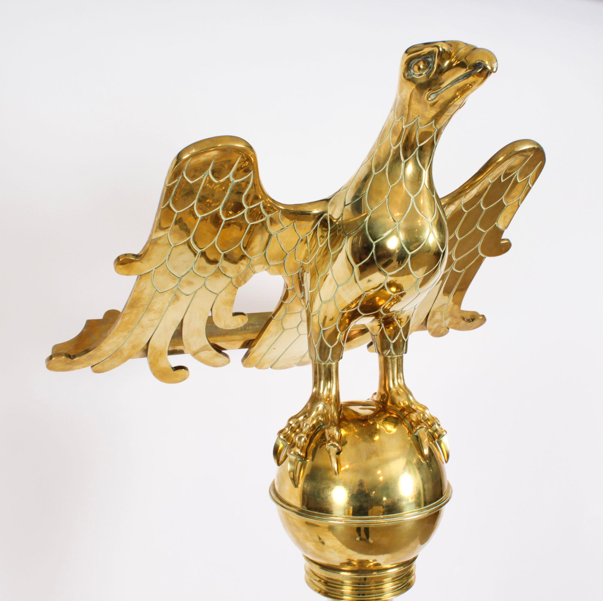 This is an impressive antique brass Victorian  eagle lectern, circa 1890 in date.

The 5ft6inch (164cm) lectern features an eagle with wings outstretched and detailed feathers to form the book rest,  on a ball surmounting a knopped column.

The