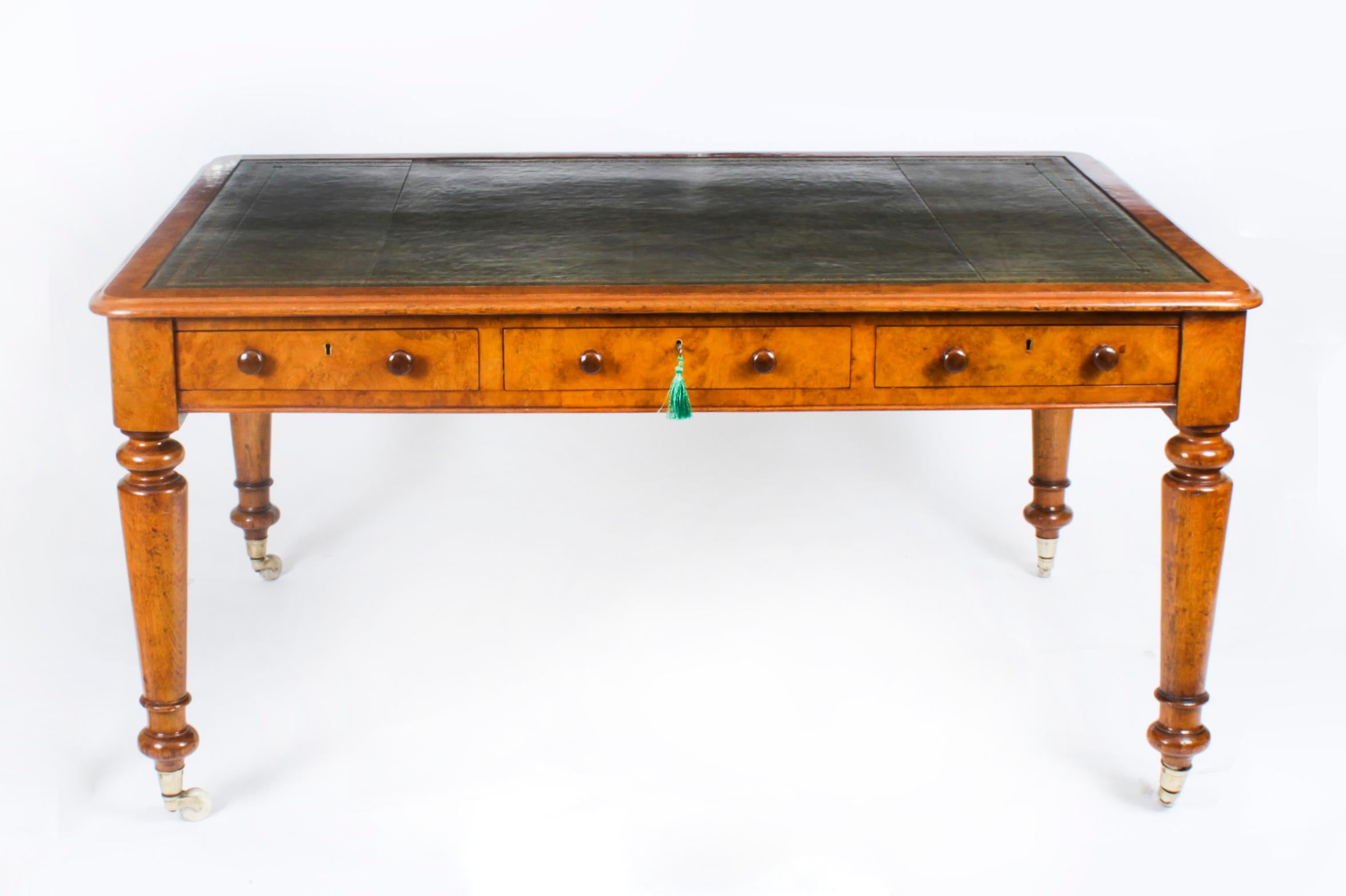 This gorgeous early Victorian antique Partners desk is crafted from beautiful pollard oak and dates from Circa 1850.
 
The rectangular top with rounded corners features a striking olive green inset leather writing surface that has beautiful hand