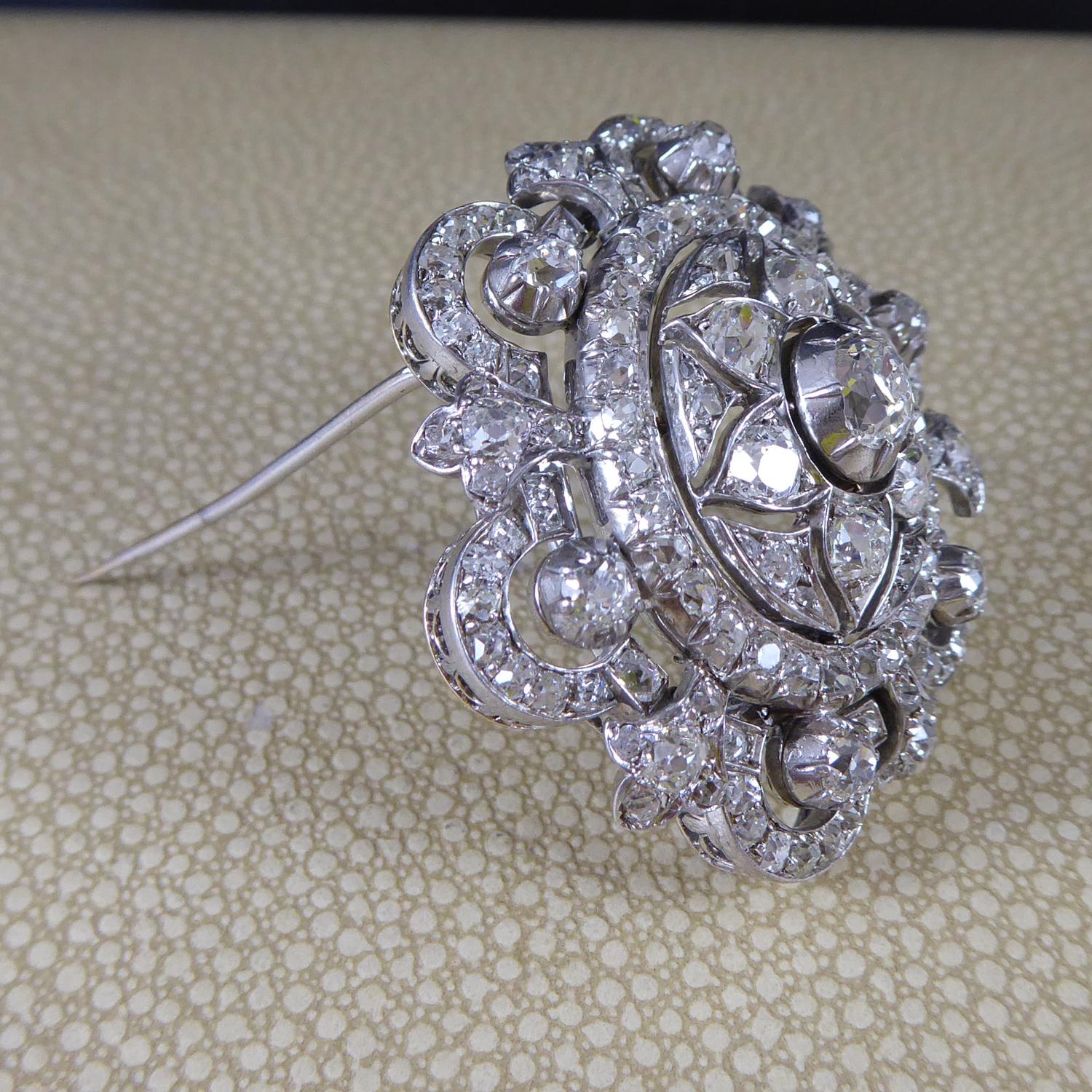 Of imposing proportions and in a typical Victorian style, this magnificent brooch features 6.00ct of diamonds in a foliate design.  

Centring on an open work flower motif, with a pinch claw set, cushion shaped old cut diamond, measuring approx.