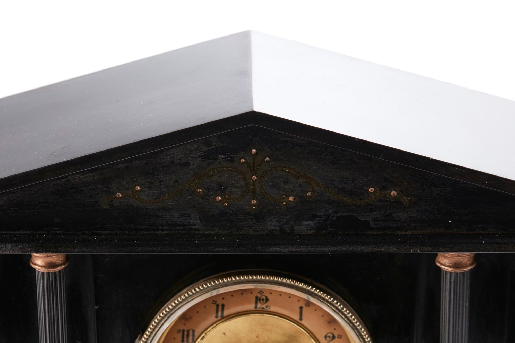 Antique Victorian 8 Day Marble Mantle Clock having an architectural top supported by 6 Corinthian columns. 8 day movement with brass dial standing on a plinth base. Perfect working order and original key.