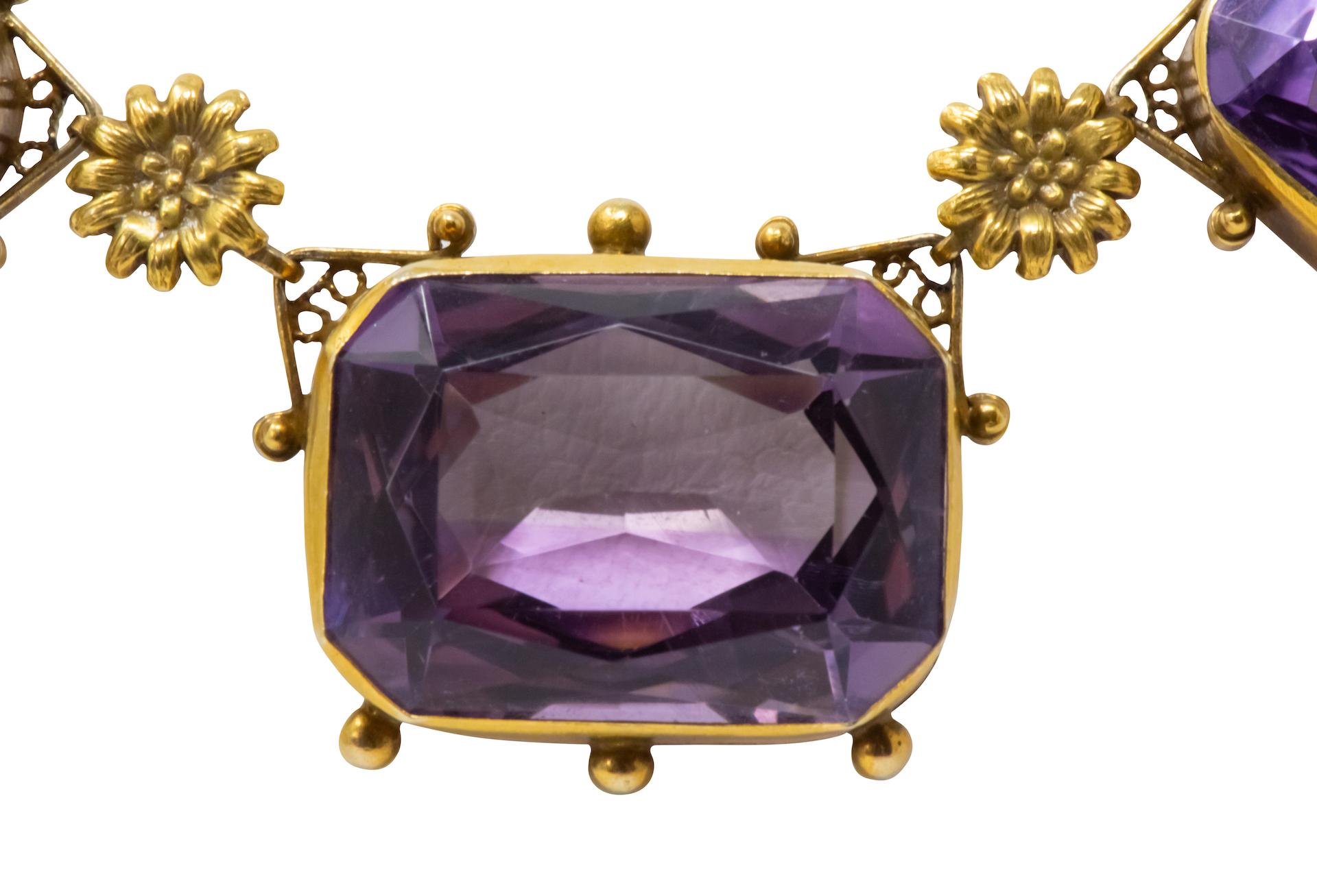 Featuring five rectangular cushion cut amethysts weighing approximately 81.83 carats total, medium light purple color and very well matched

Amethysts are bezel set in delicate gold frames accented by gold flower links and gold bead detail

With