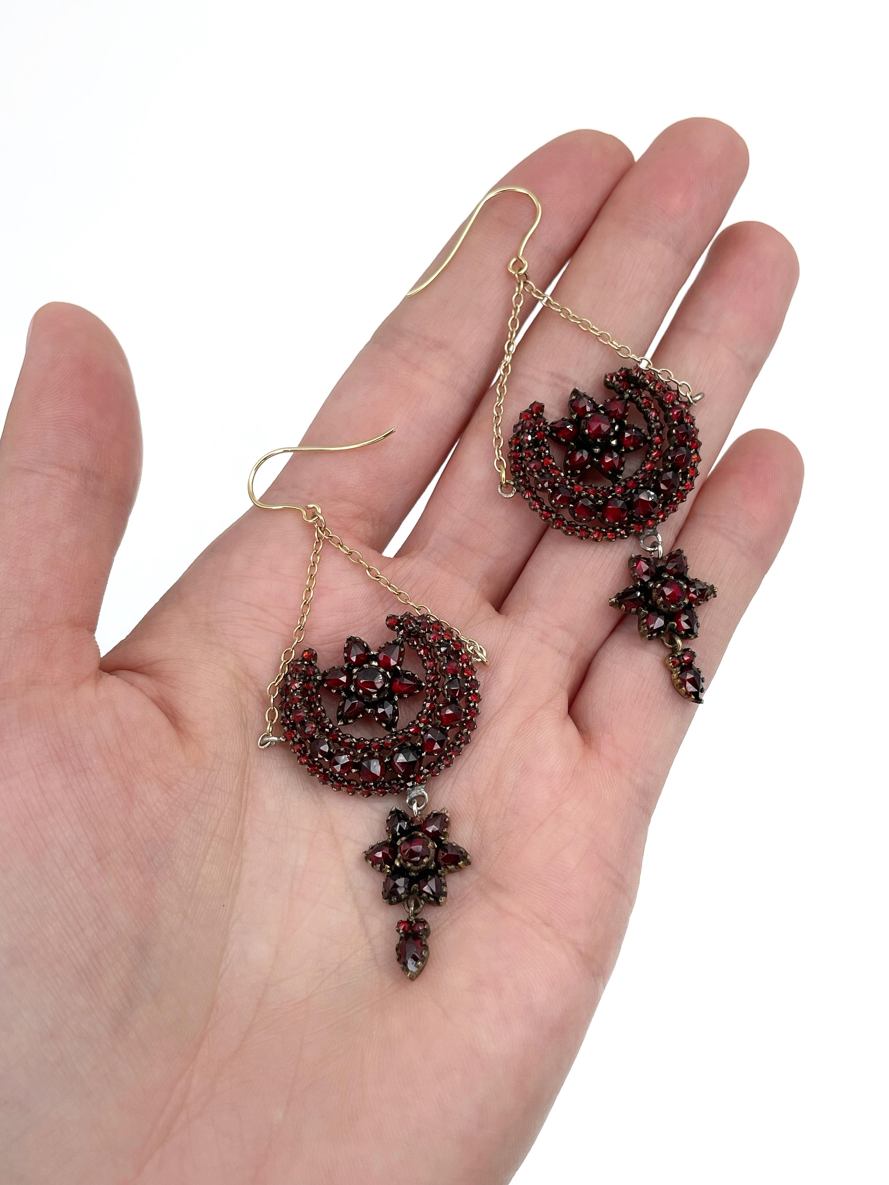 This is an impressive pair of Victorian dangle earrings crafted in 9K gold and adorned with silver. It features beautiful rich red colour faceted Bohemian garnets of various sizes. 

It is a fabulous Victorian piece. These earrings are exceptional