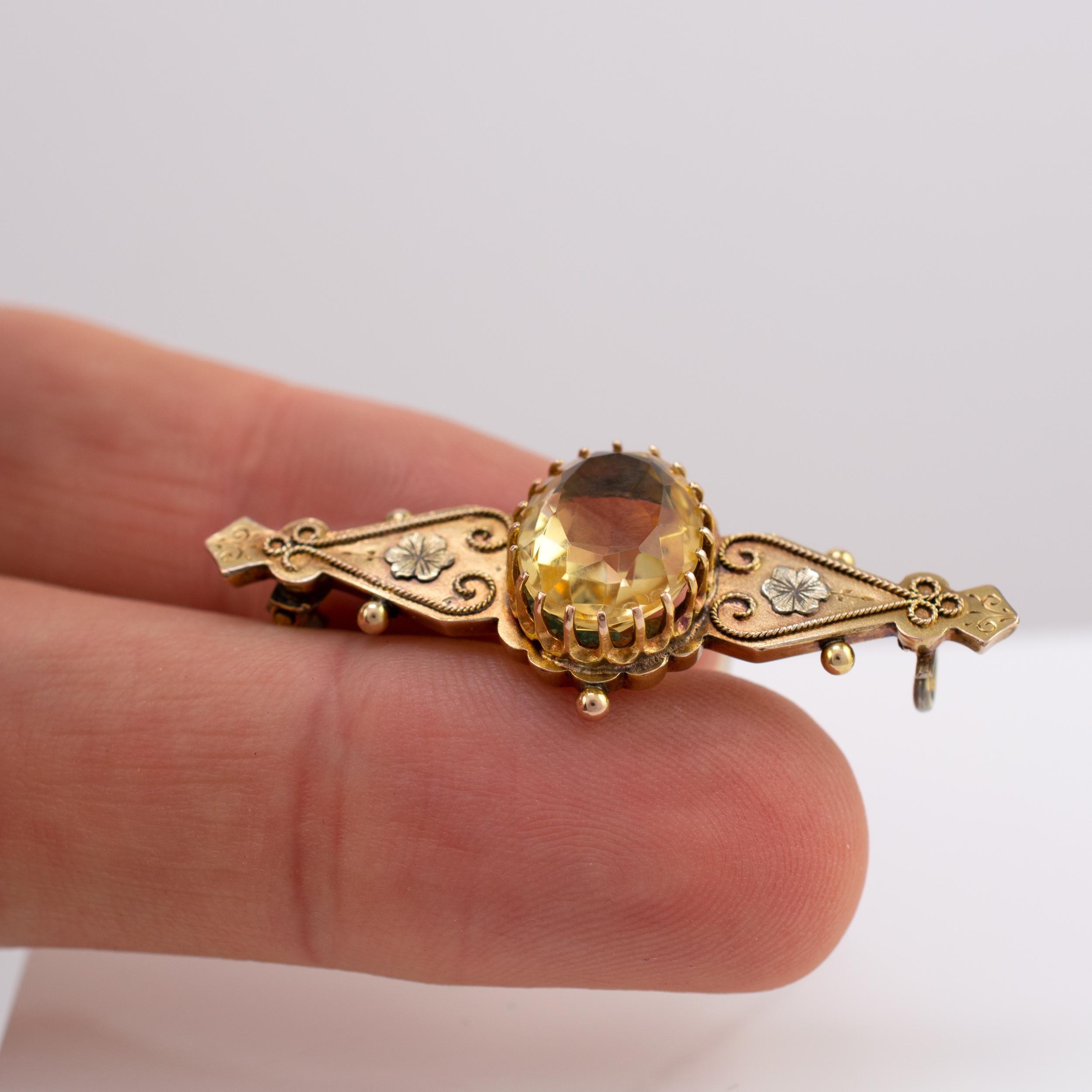 Oval Cut Antique Victorian Citrine Brooch with Cannetille Flowers Dated 1886 For Sale