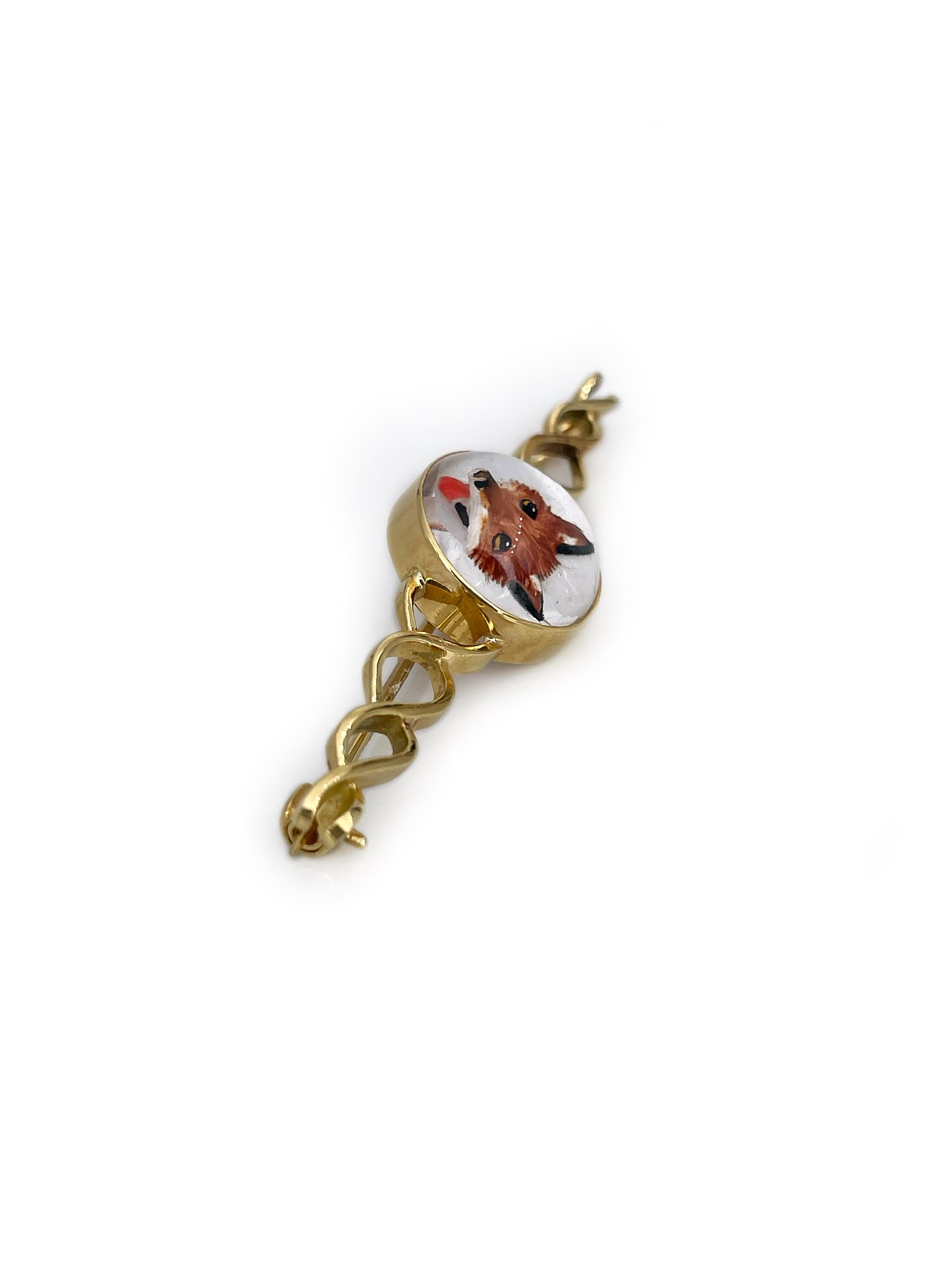 This is a Victorian bar brooch crafted in 18K yellow gold depicting a cute fox. The circular detail is made of cabochon cut rock crystal, which back is covered with nacre. The picture of a fox is hand drawn and is remarkably lifelike. 

The piece is