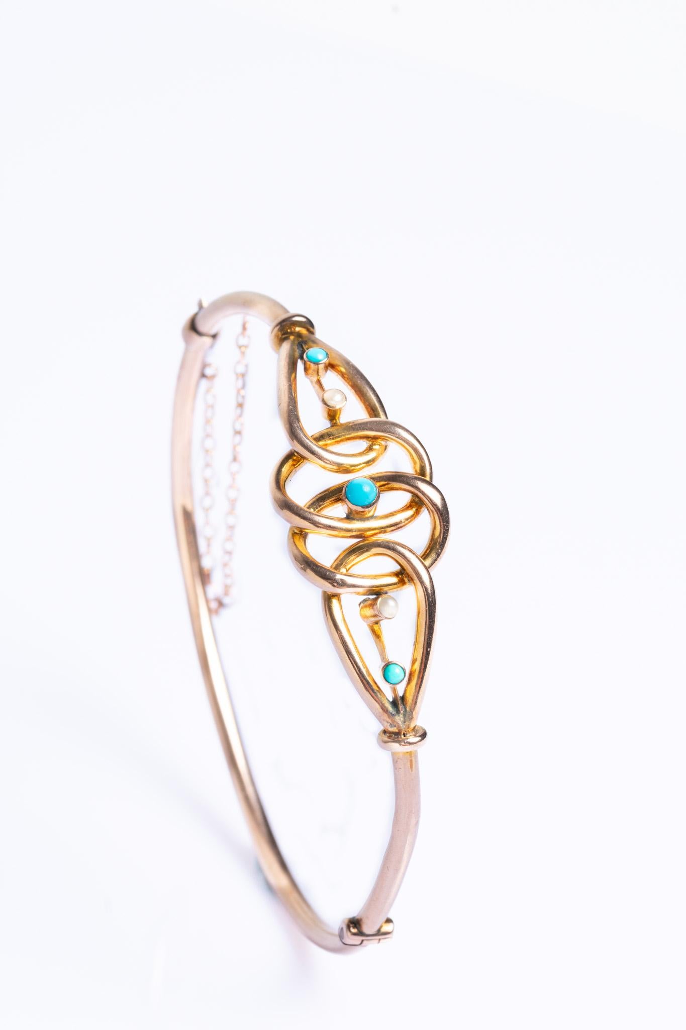 This stunning Victorian-era 9ct gold turquoise and pearls hinged bangle is beautifully made over a century ago with bright, summery turquoise and delicate pearls. The bangle would be a great gift for any antique jewellery admirer or a gorgeous treat