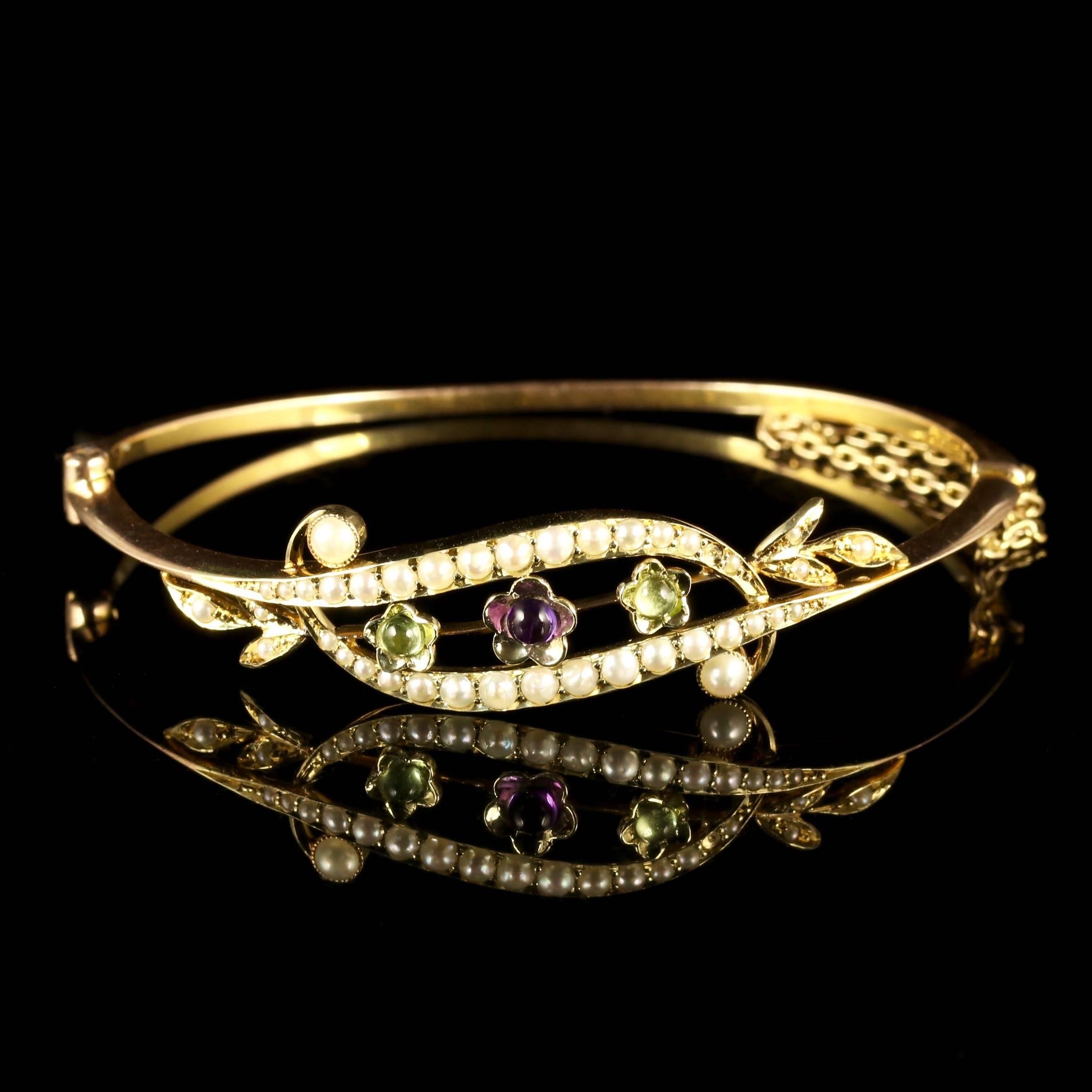 This fabulous Victorian 15ct Gold Suffragette bangle is Circa 1900.

This beautiful bangle with is adorned in Amethysts, Peridots and Pearls in a floral style gallery.

Suffragettes liked to be depicted as feminine, their jewellery popularly