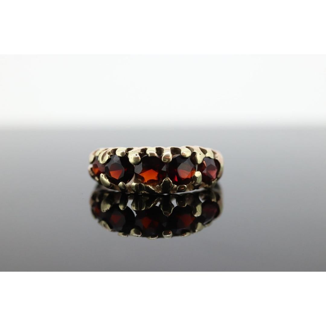 Vintage from the 1900s
Size: 7 US
Materials: Stone
Gemstone: Garnet
Gem color: Red
Band color: Gold

Style: Victorian

About this item

9k 375 Hallmarked Gold with a European stamps. Made in Chester 1905
5mm +/- garnets
3.1grams total weight
sz