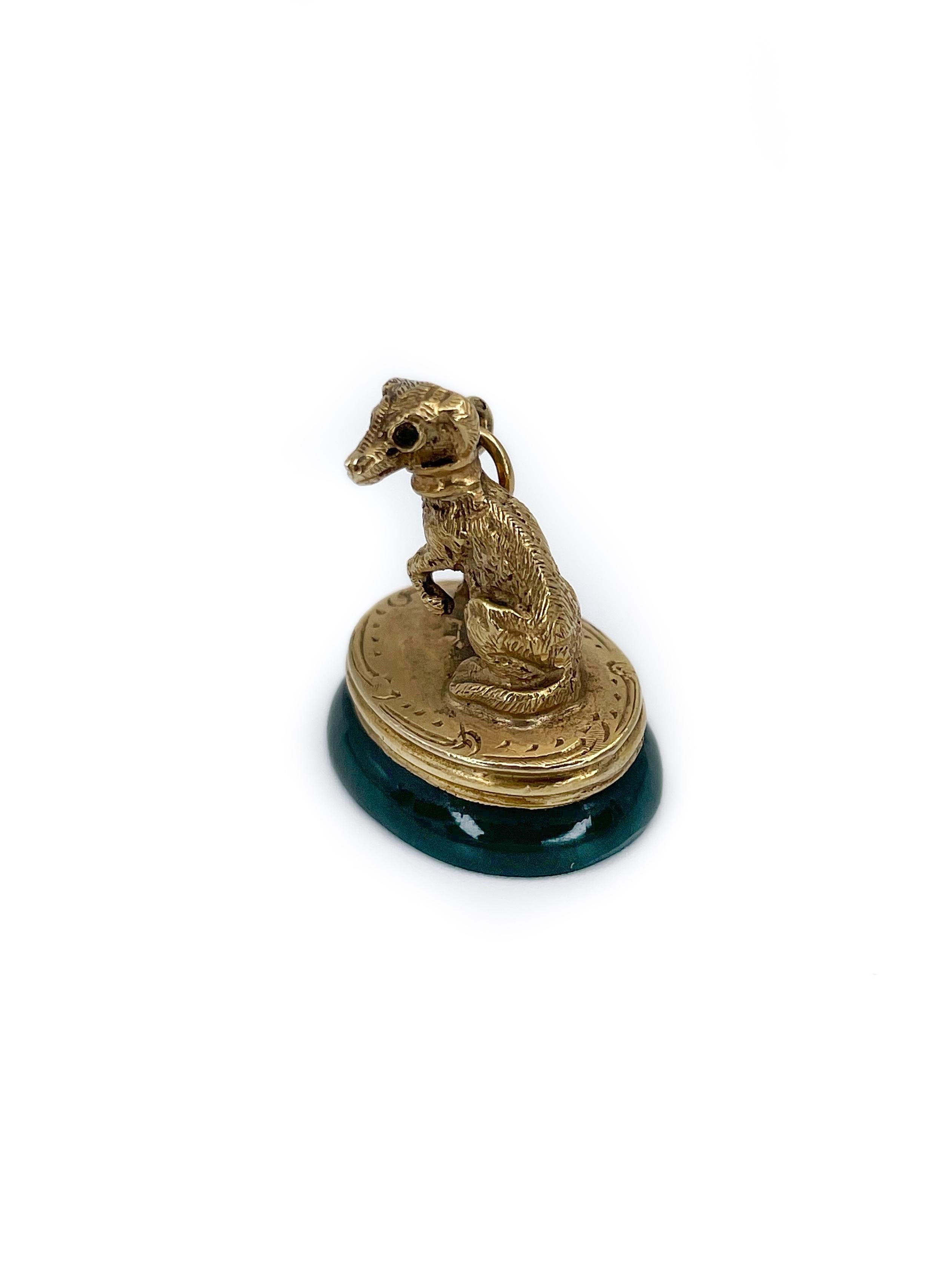 This is an exceptional Victorian watch fob seal pendant depicting a greyhound dog. It is crafted in 14K gold. The piece features green oval bloodstone (8.00ct) engraved with stylised initials.

Figural fobs are very desirable and this one is really