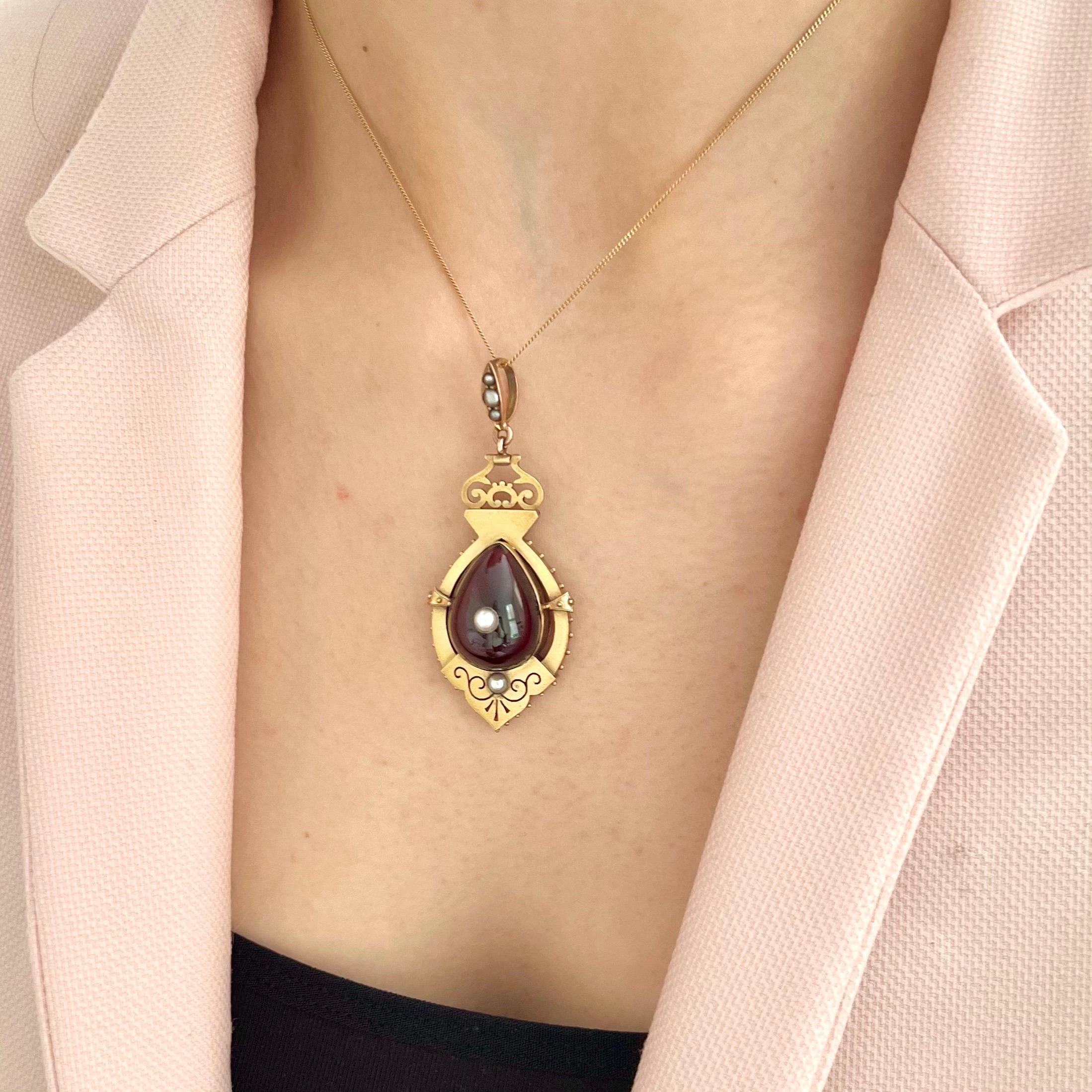 Oval Cut Antique Victorian 9K Gold Locket Pendant with Garnet and Seed Pearls, Circa 1870 For Sale