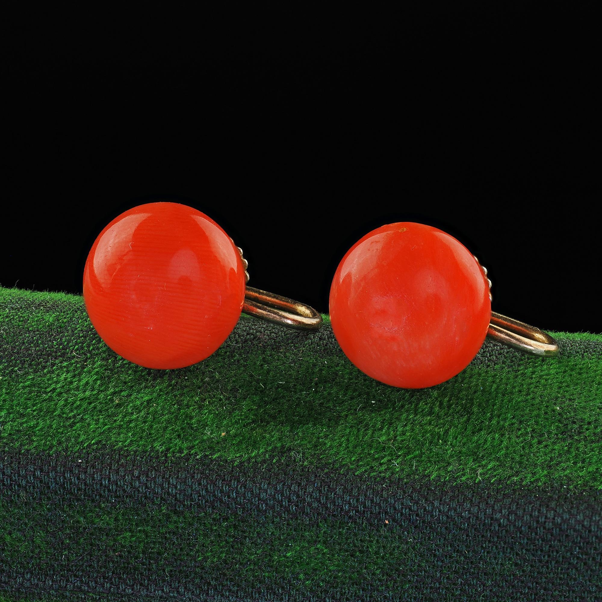 Beautiful Antique Victorian 9K Yellow Gold Natural Red Coral Screw Back Earrings. This beautiful pair of Victorian natural coral screw back earrings are crafted in 9k yellow gold. The earrings features beautiful round corals set in an antique screw