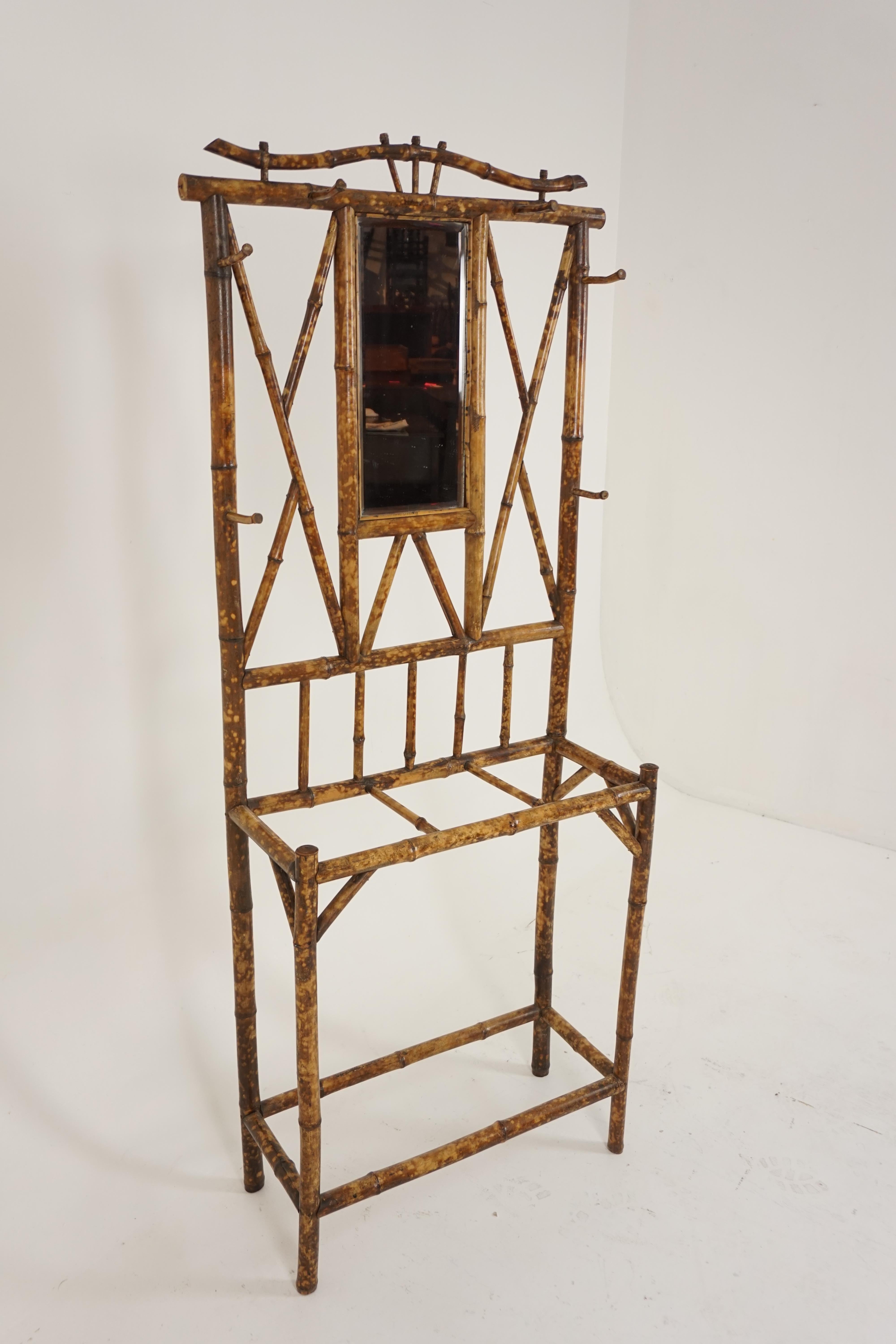 Antique Victorian aesthetic bamboo hall stand, Scotland, 1880

Scotland, 1880
Bamboo construction
Original finish
Beveled mirror to the top
Six bamboo hanging hooks
Three dividers fitted for walking sticks and umbrellas
Standing on four