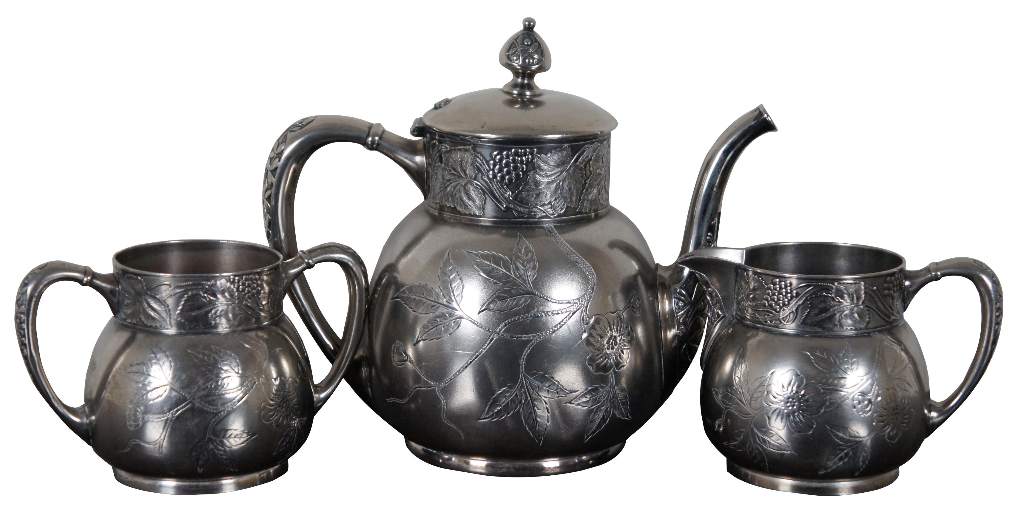 Antique quadruple silver plate three piece tea set by the Pairpoint Manufacturing Co. of New Bedford Massachusettes. 324.

Measures: 9.5” x 5.5” x 8” / Sugar Bowl - 6.25” x 4” x 4” / Creamer - 5.75” x 4” x 4” (width x depth x height).
  