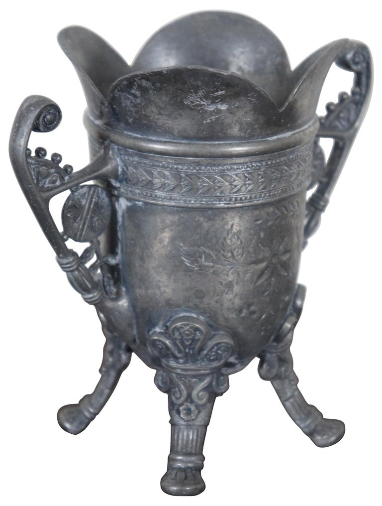 Aesthetic period Pairpoint Manufacturing Company, quadruple silver plate footed and handled vase or urn, number 817.
 