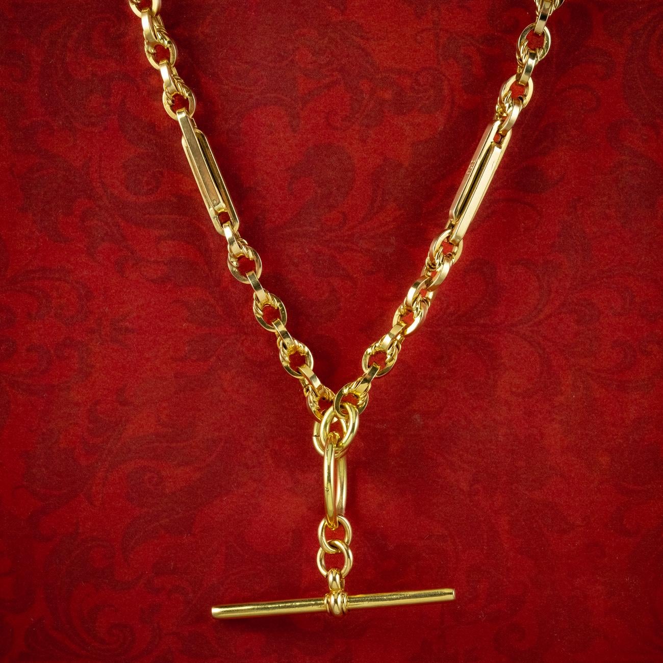A classic antique Victorian Albert chain from the late 19th Century made up of interlocking fetter links, with smaller cable links in between, all crafted in 9ct gold with a bright, yellow gold bloom.

Albert chains were popularised and named after