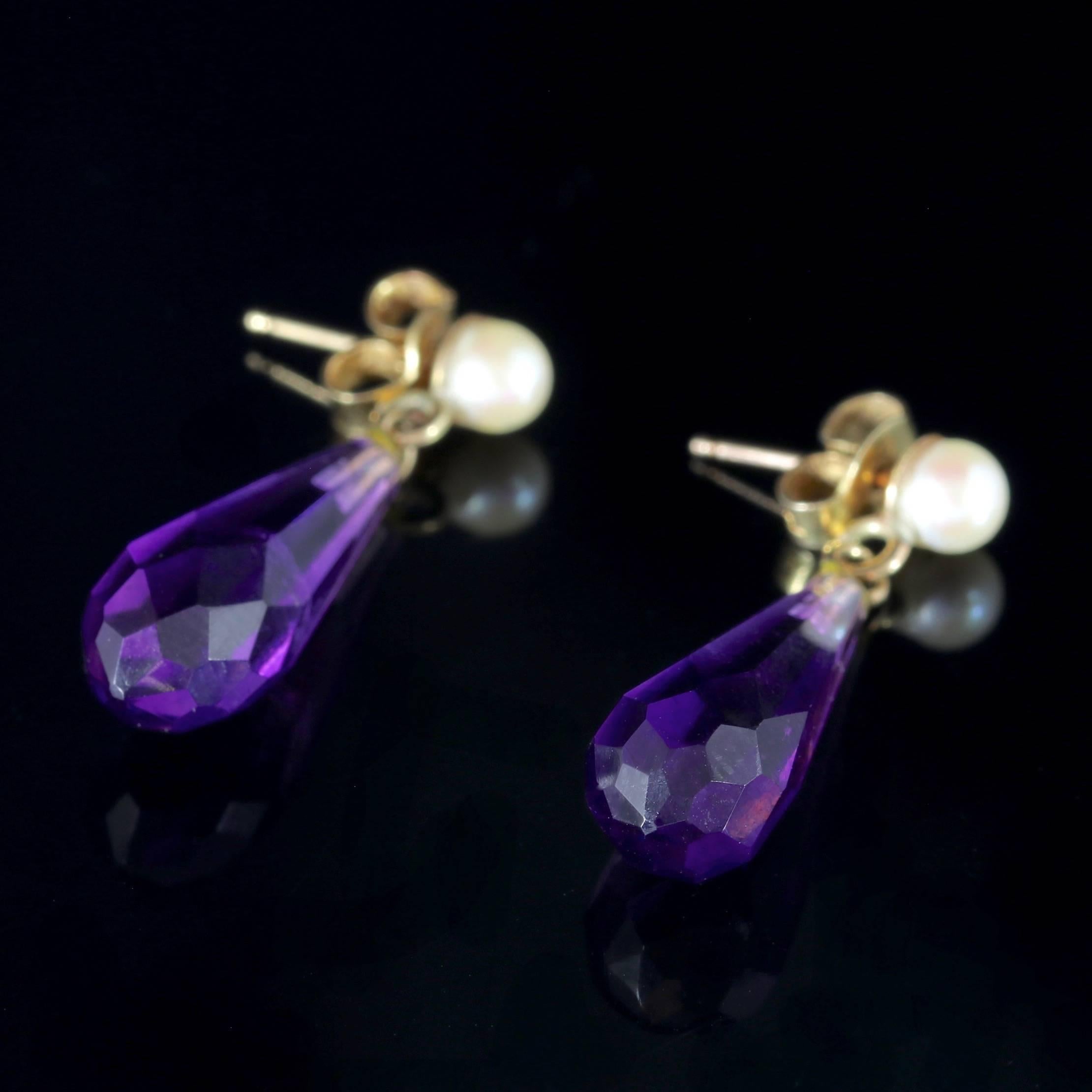 To read more please click continue reading below-

These fabulous antique 18ct Gold Amethyst drop earrings are Victorian Circa 1900. 

Each earring is adorned with a beautifully cut Amethyst dropper crowned with a lovely Pearl. 

Amethyst has been
