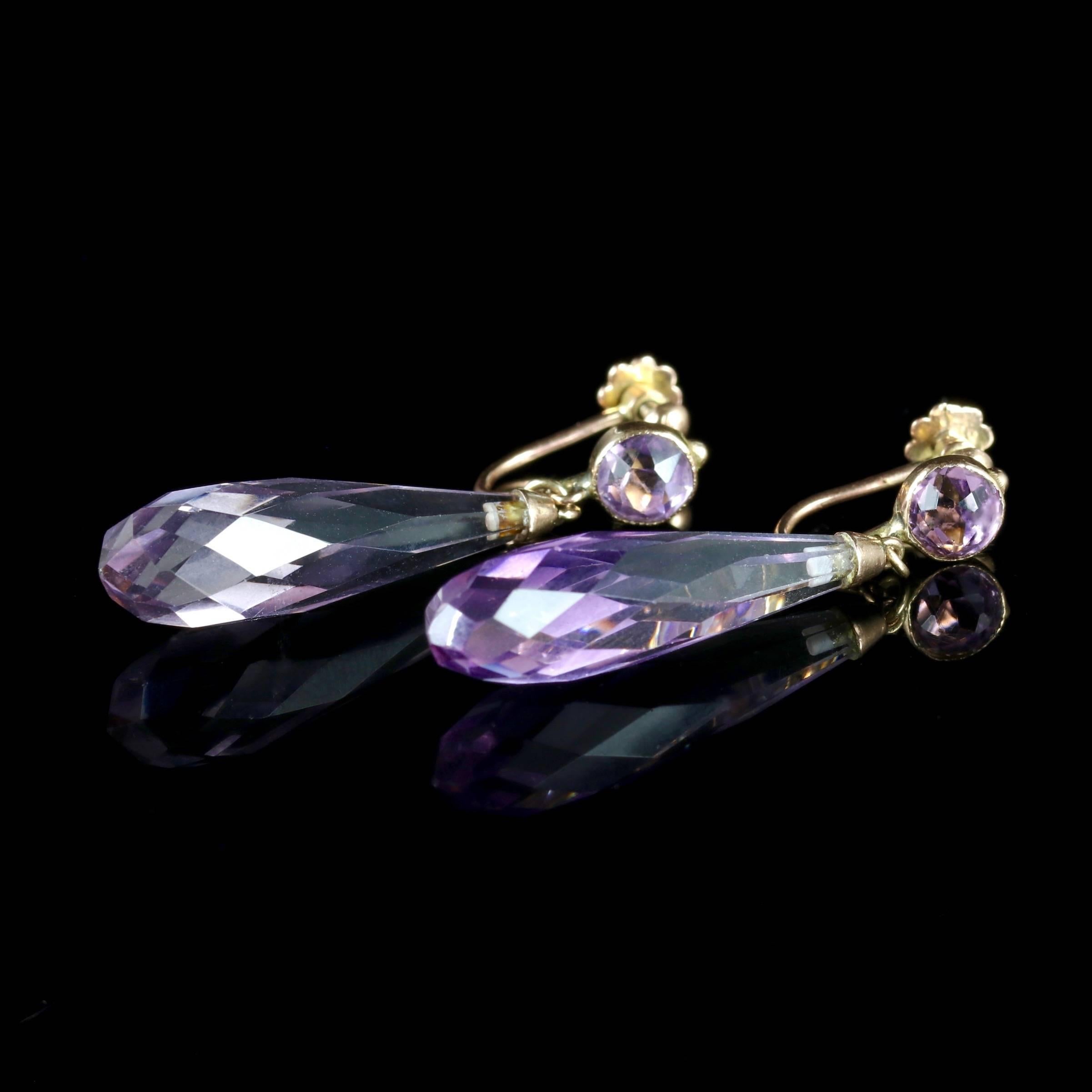 These fabulous 9ct Gold Amethyst faceted earrings are Victorian, Circa 1900. 

Each earring is adorned with a beautifully cut faceted Amethyst which catches the light all the way round.

Amethyst has been highly esteemed throughout the ages for its