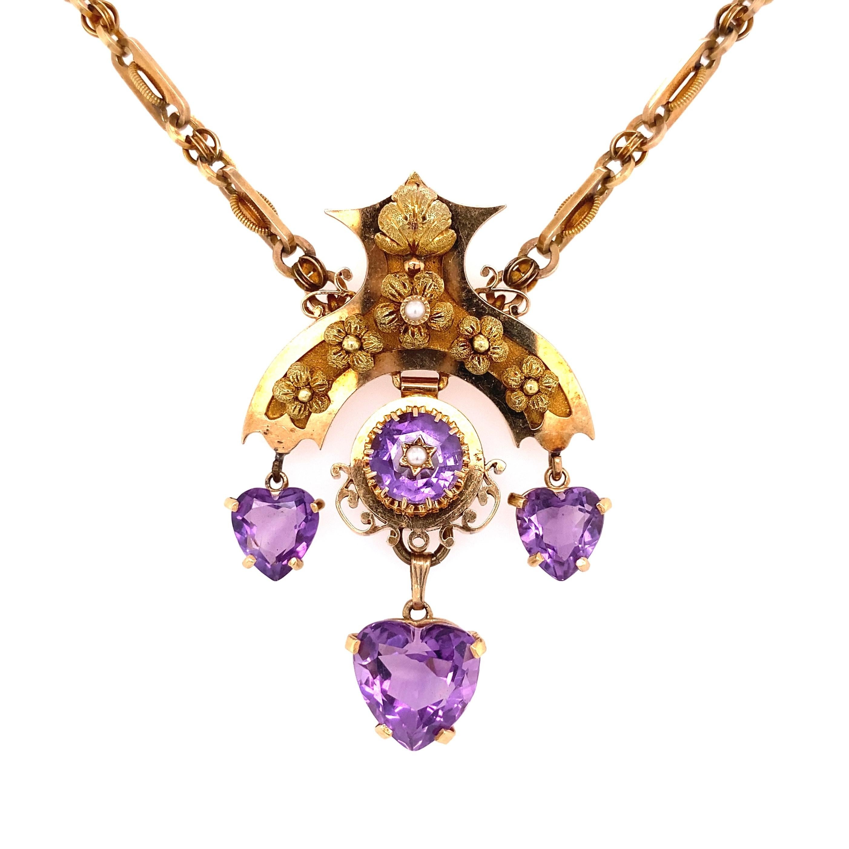 Simply Beautifully! Victorian Amethyst Hearts and Seed Pearl Gold Necklace. Hand set with 3 Amethyst Hearts dangling from a stylized Gold Crown. Suspended from a 14K Yellow Gold intricately Hand crafted Link Chain. Pendant measures approx. 2.35” l x