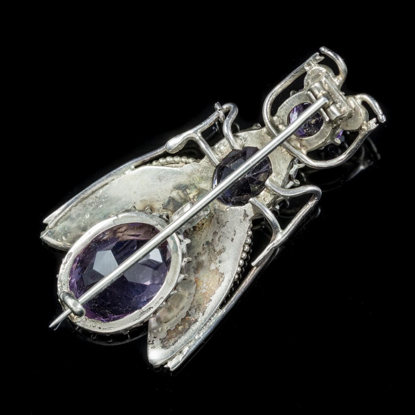 This wonderful antique Amethyst bug brooch is from the Victorian era, Circa 1900.

Insect jewellery is highly collectable and was a symbol of good luck to the wearer during the Victorian Era.

The brooch is adorned with three beautifully cut rich